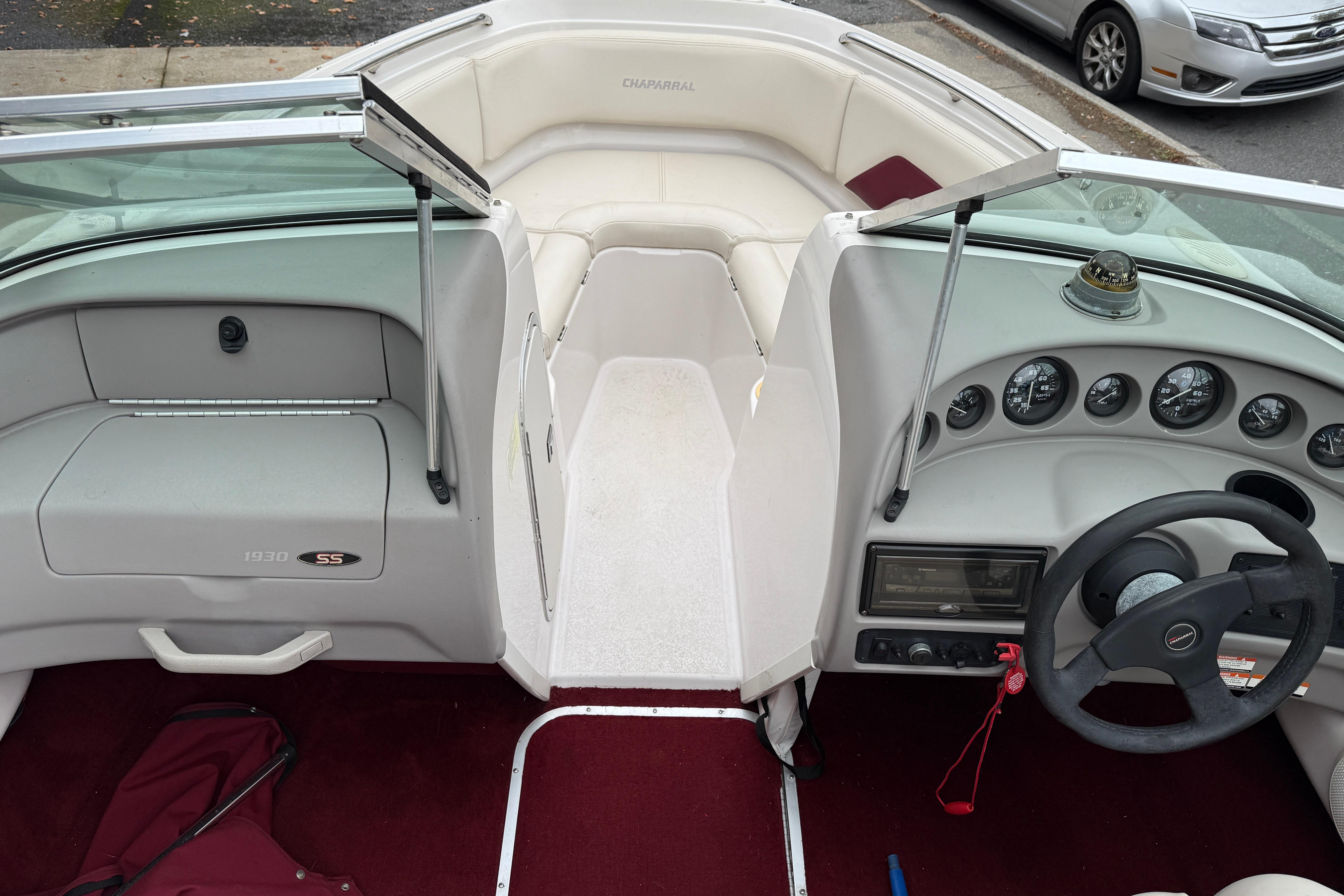 Interior of a 1999 Chaparral 1930 SS boat with dashboard and seating area.