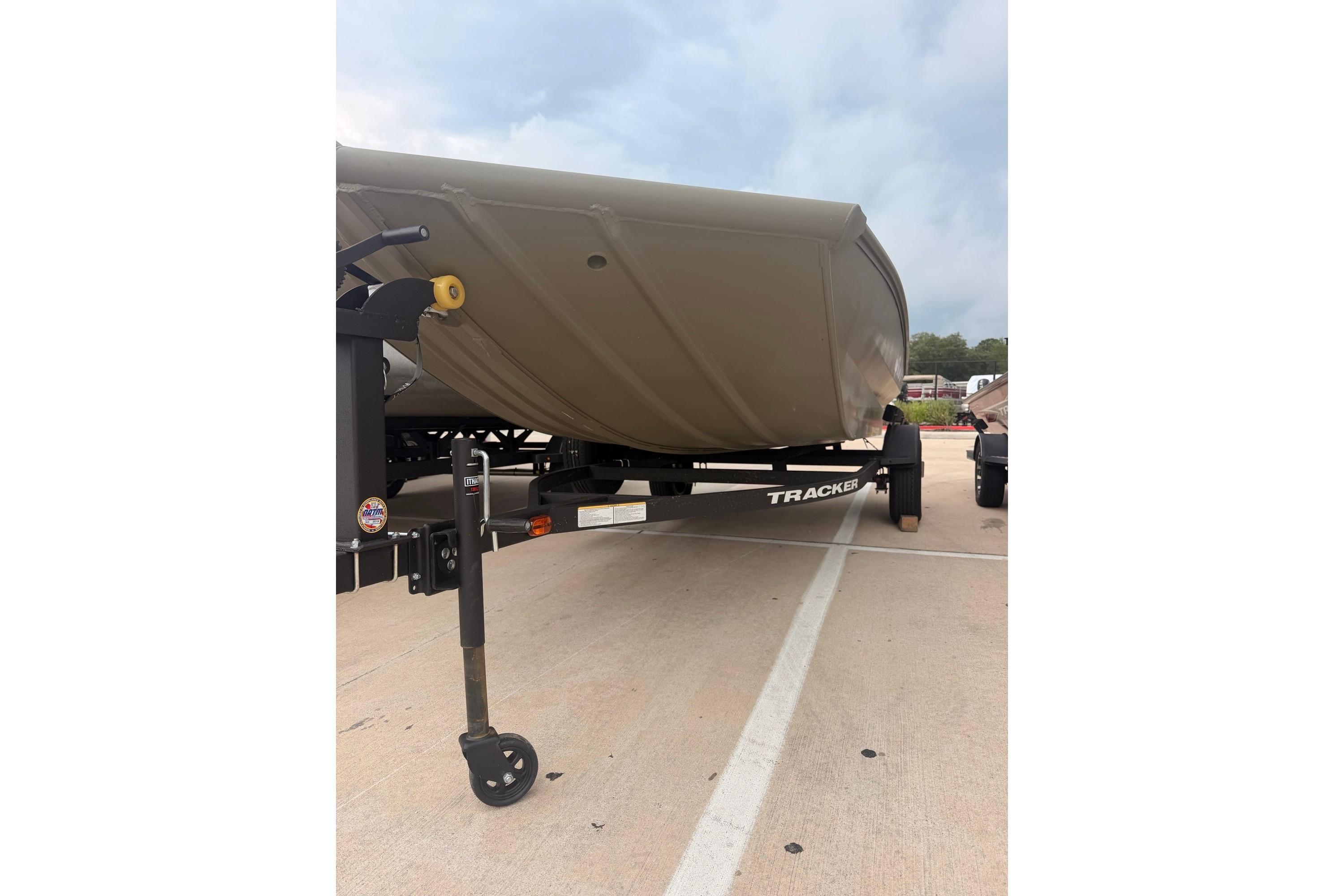 2026 Tracker Grizzly 1756 MARSH boat on trailer, parked outdoors.