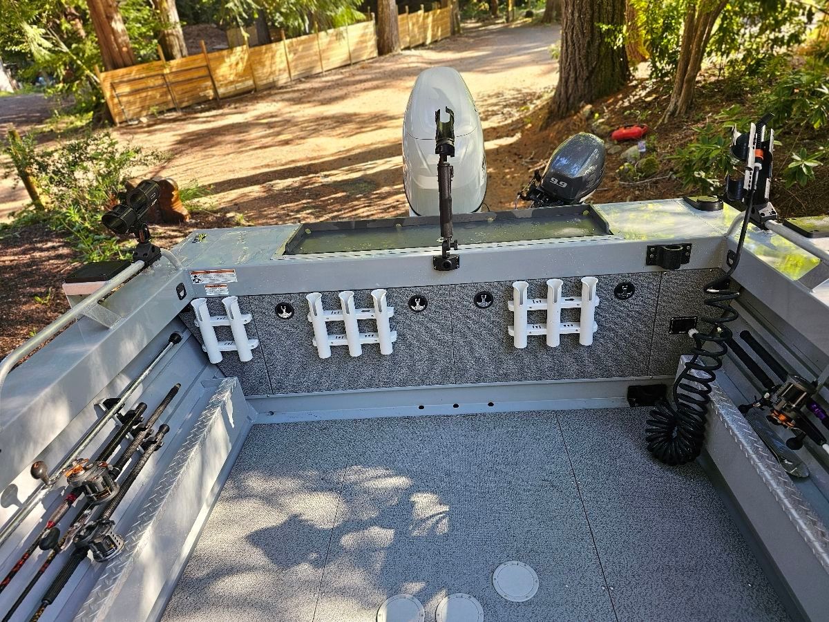 The image shows the stern of a 2021 Hewescraft Sea Pro 200 boat with fishing rod holders.