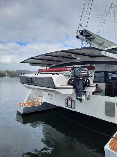 Modern Vision 444 yacht with Yamaha motor, docked in calm waters, 2025 model.