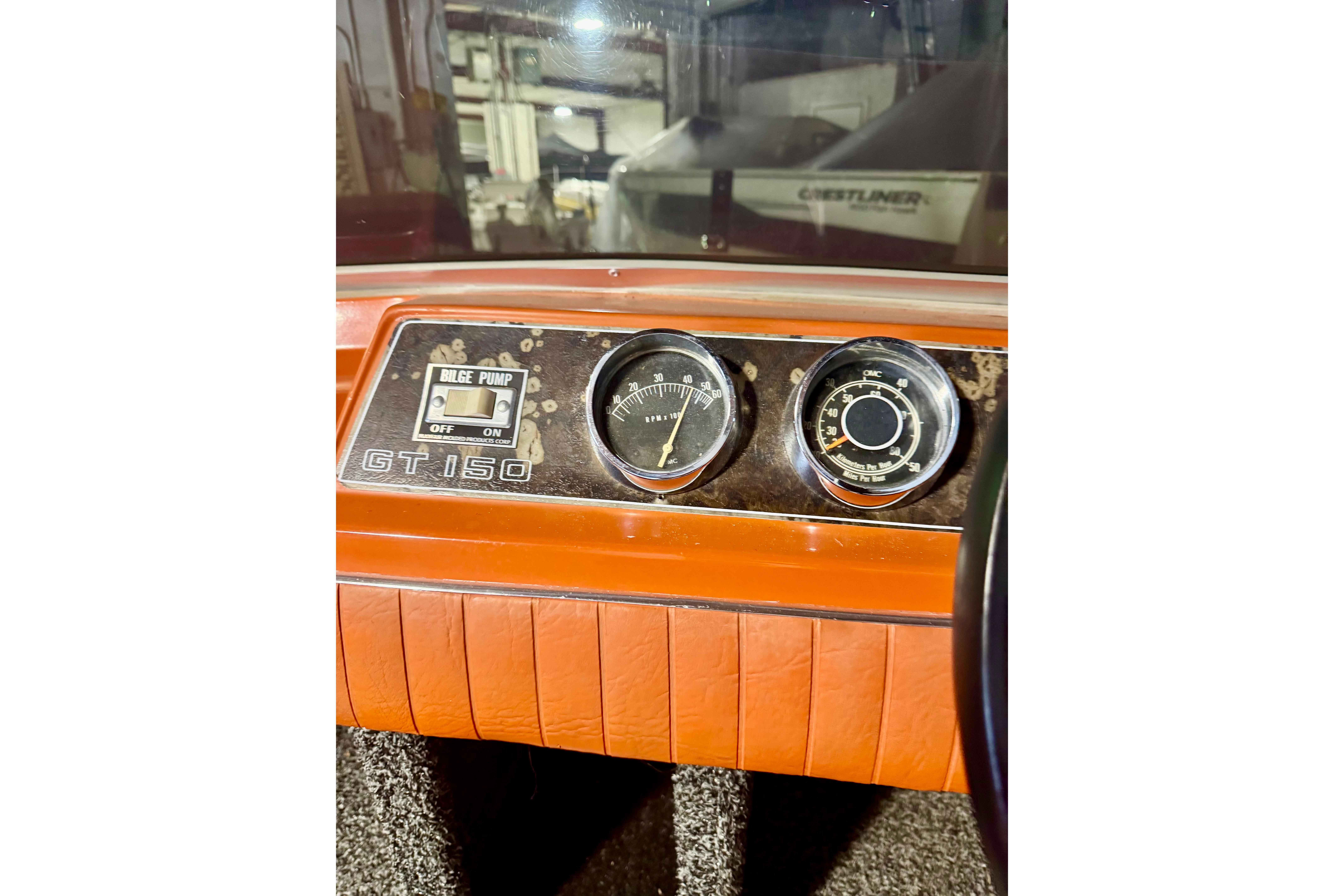 1971 Glastron/Carlson GT 15 dashboard with bilge pump switch and gauges.