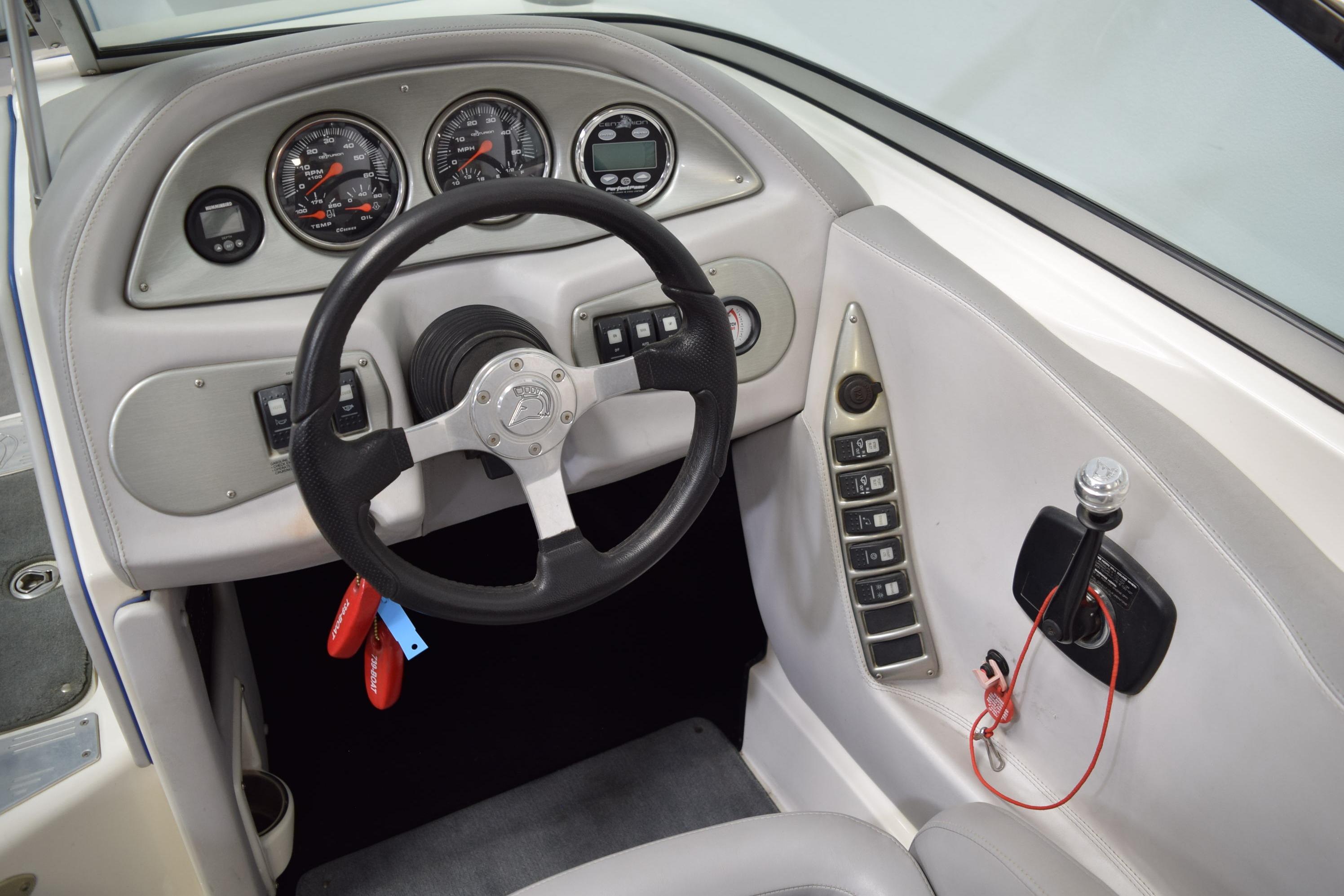 Steering wheel and dashboard of a 2007 Centurion SV 240 boat.