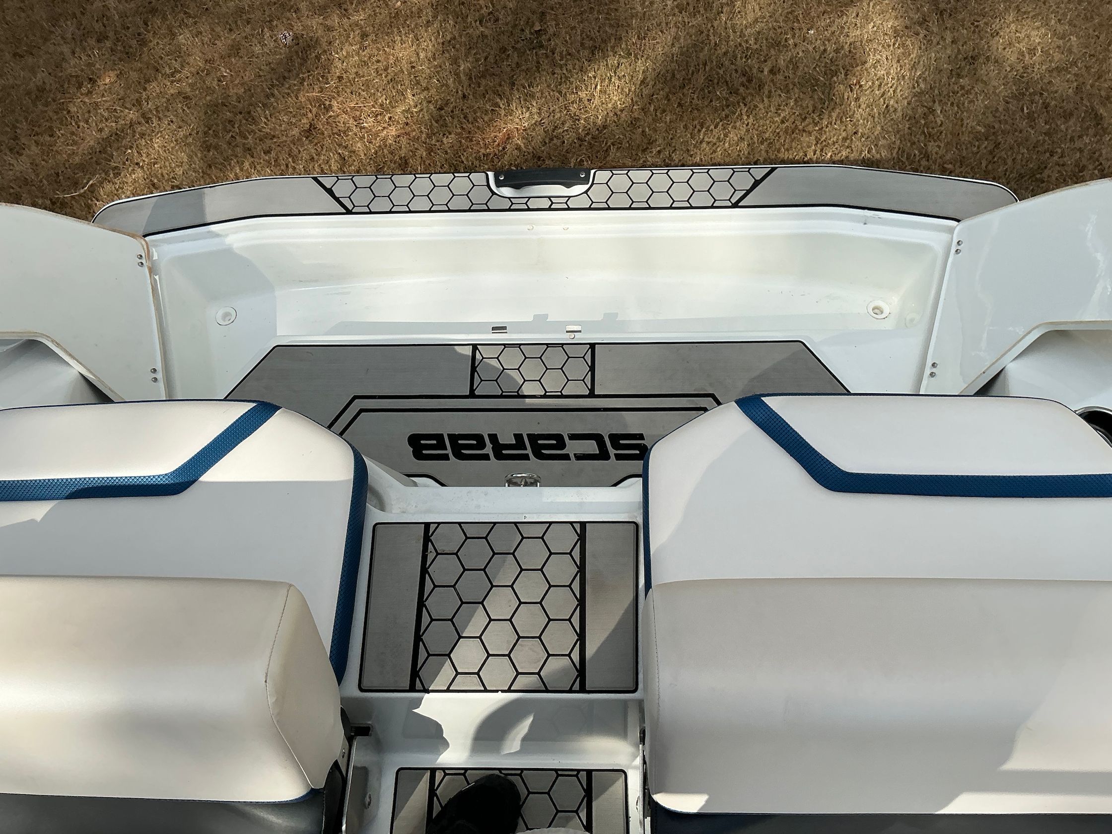 Interior of 2021 Scarab 215 ID with modern seating and flooring.