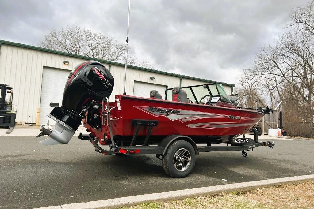 2026 Ranger VS1782SC Reata boat in red, parked outdoors on a trailer.