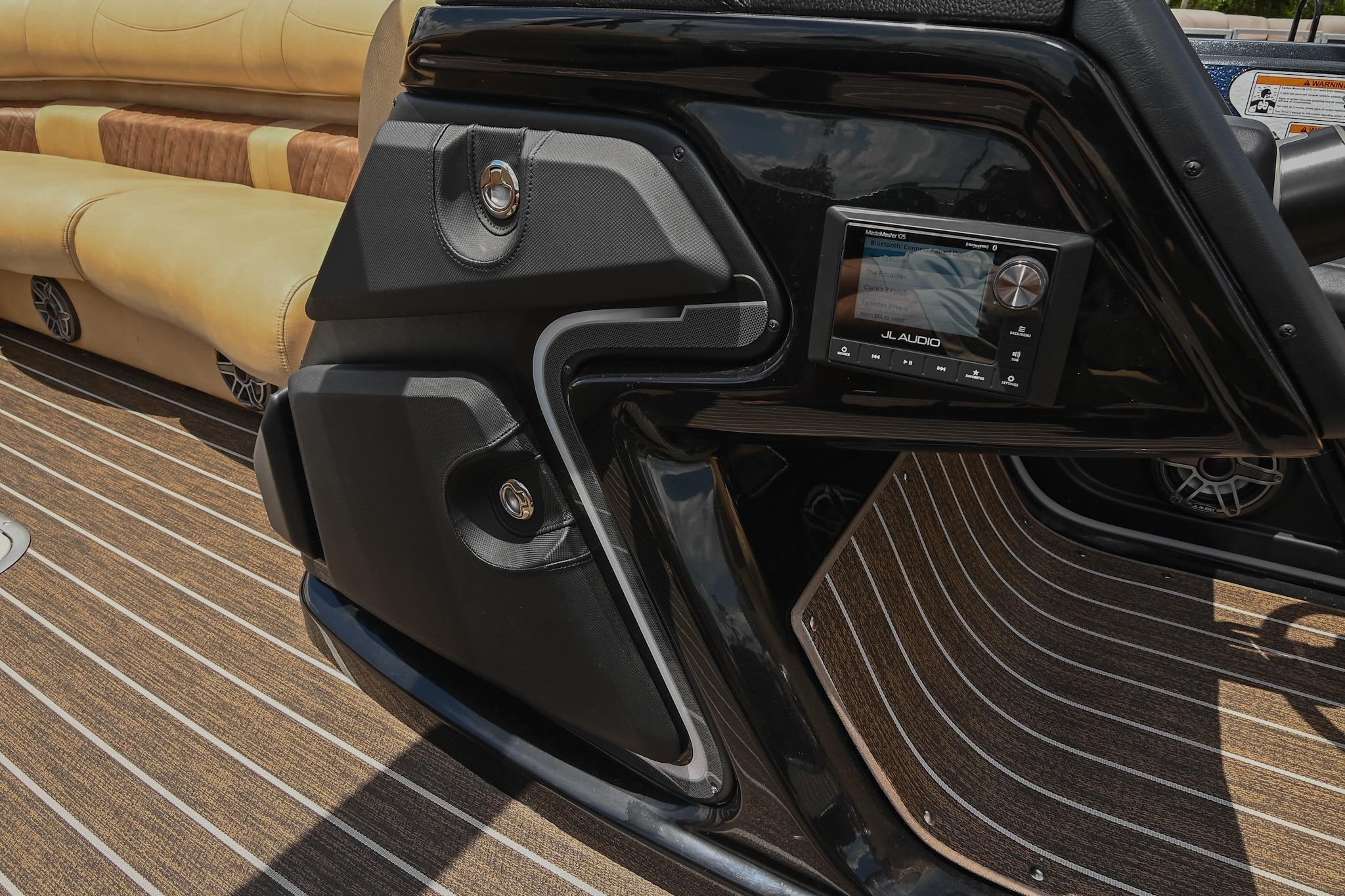 Interior of 2023 Premier 270 Intrigue RF boat with audio system and seating.