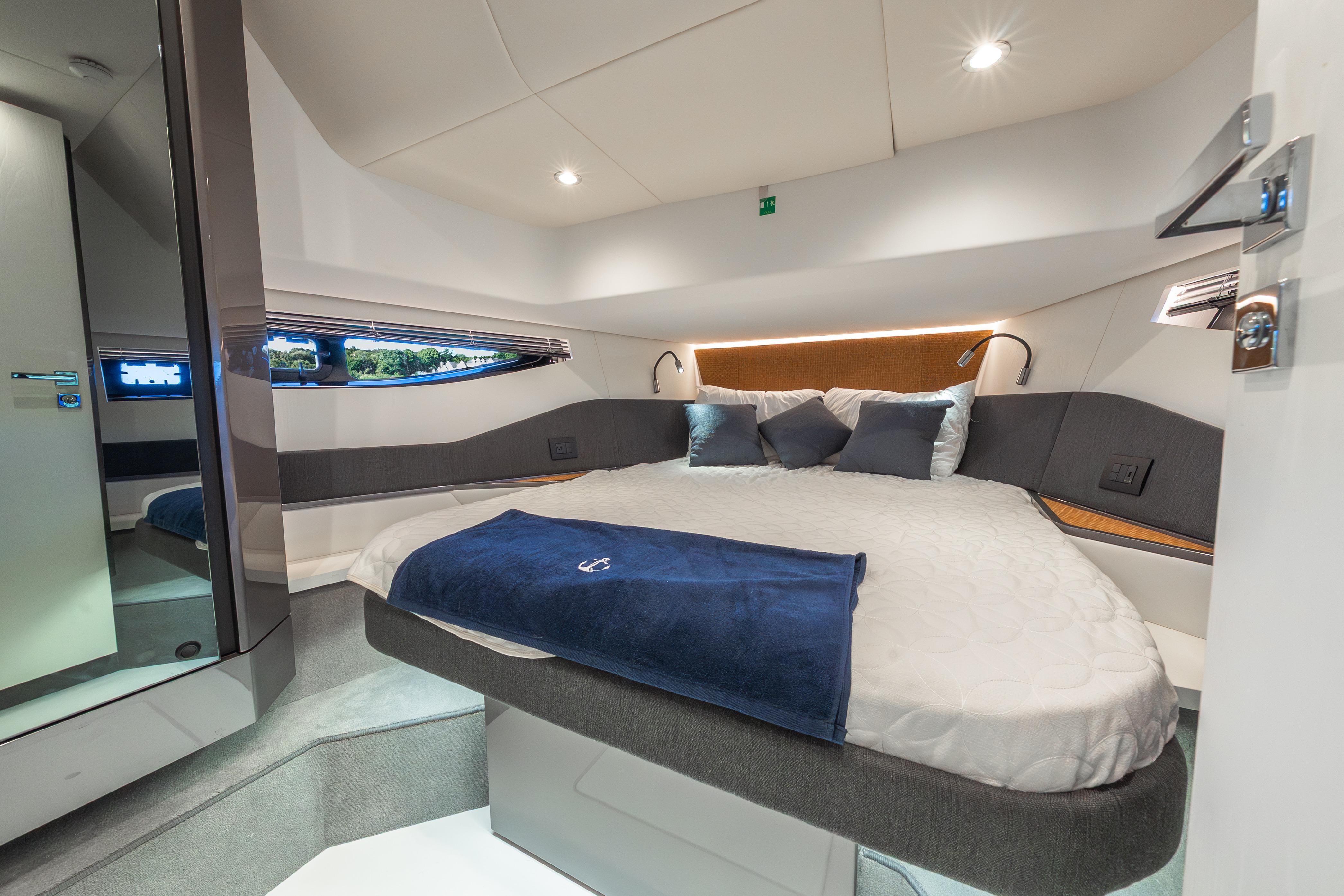 Luxurious cabin interior of 2023 Azimut Verve 47 yacht with modern bedding.