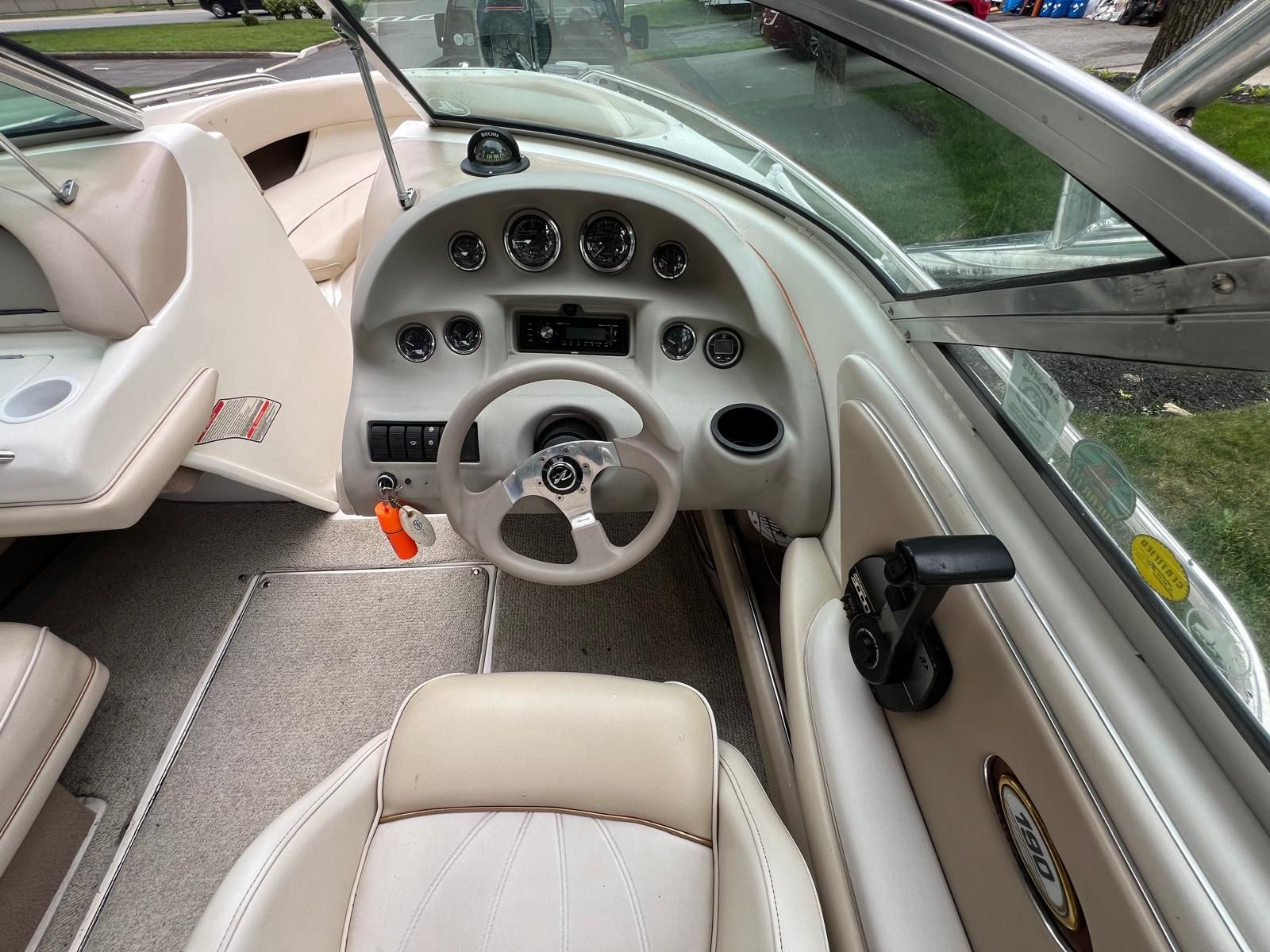 Interior view of a 1997 Sea Ray 190 Bow Rider with steering wheel and dashboard.