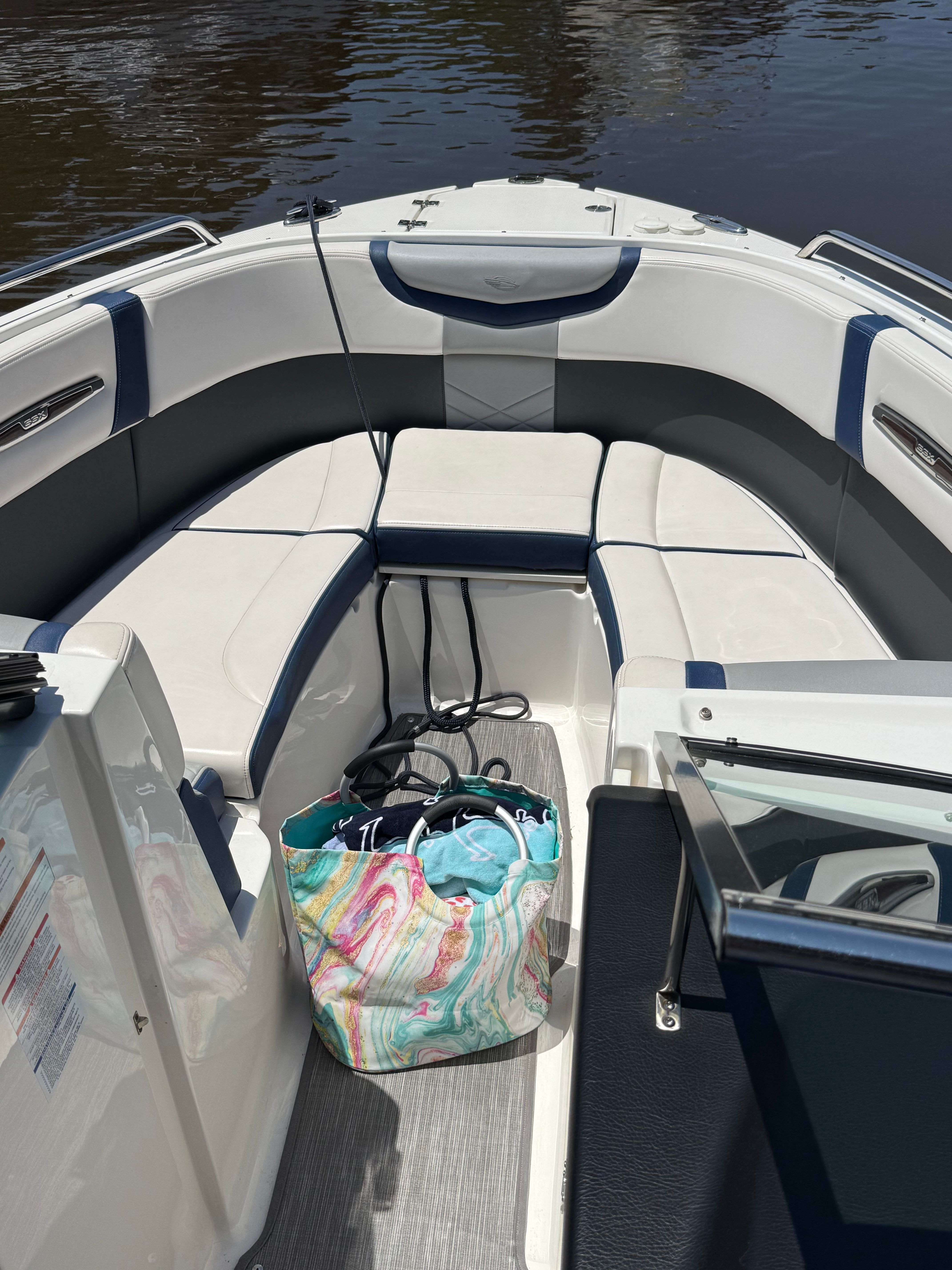 Interior of a 2020 Chaparral 256 SSX boat with colorful bag.