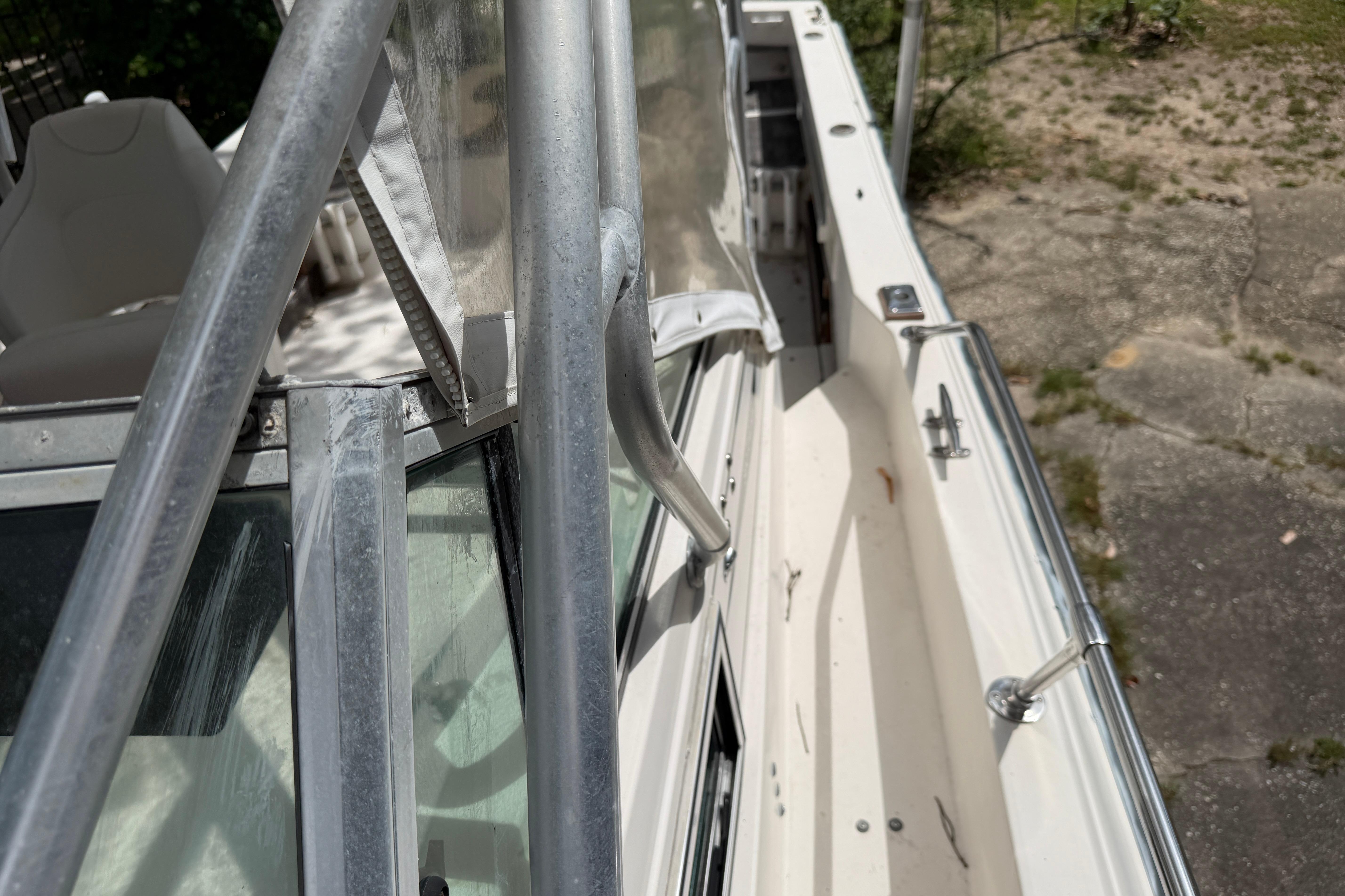 1987 Grady-White Seafarer 226 boat deck with metal railings and seating.