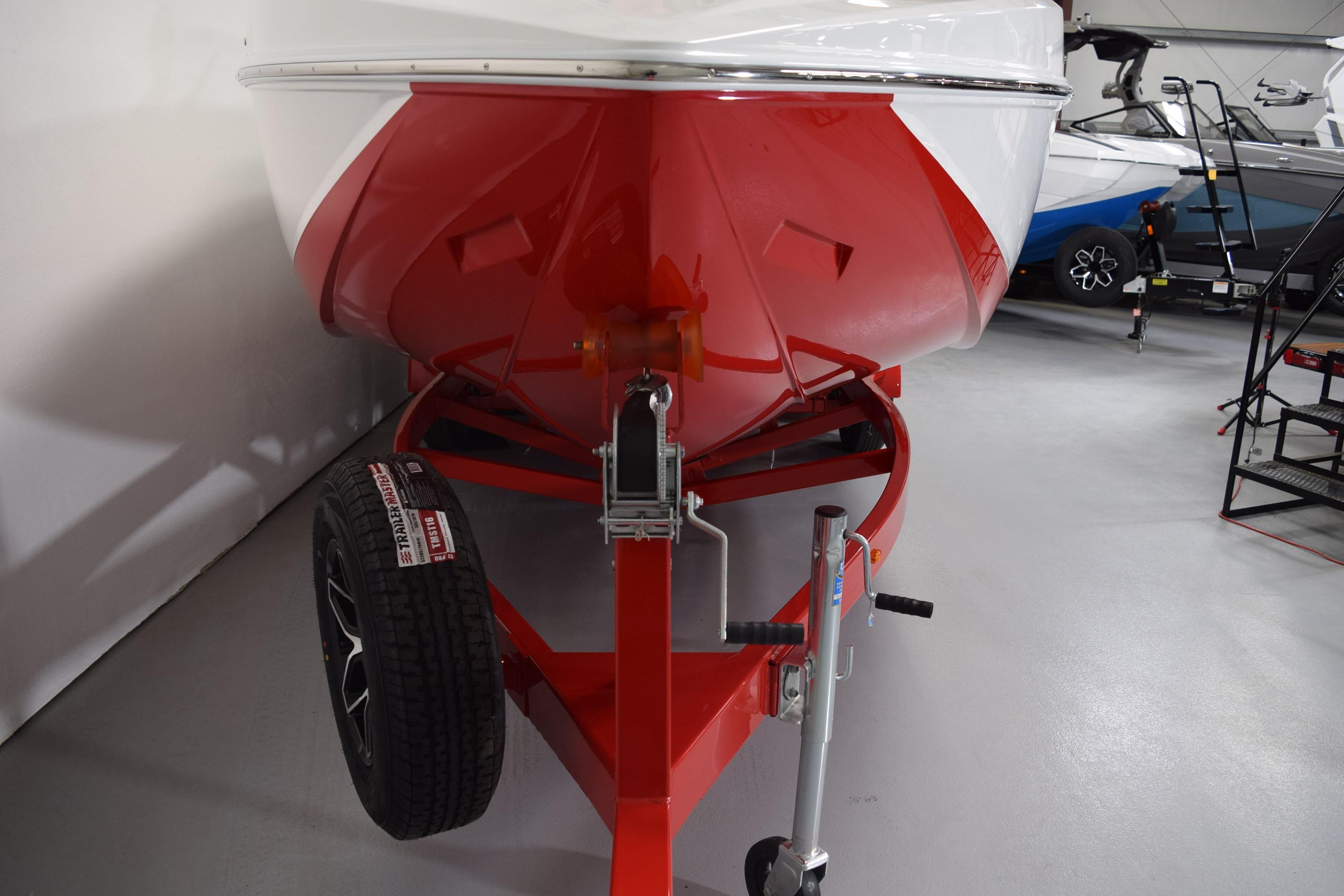 2026 Moomba Craz boat on red trailer in showroom, front view.