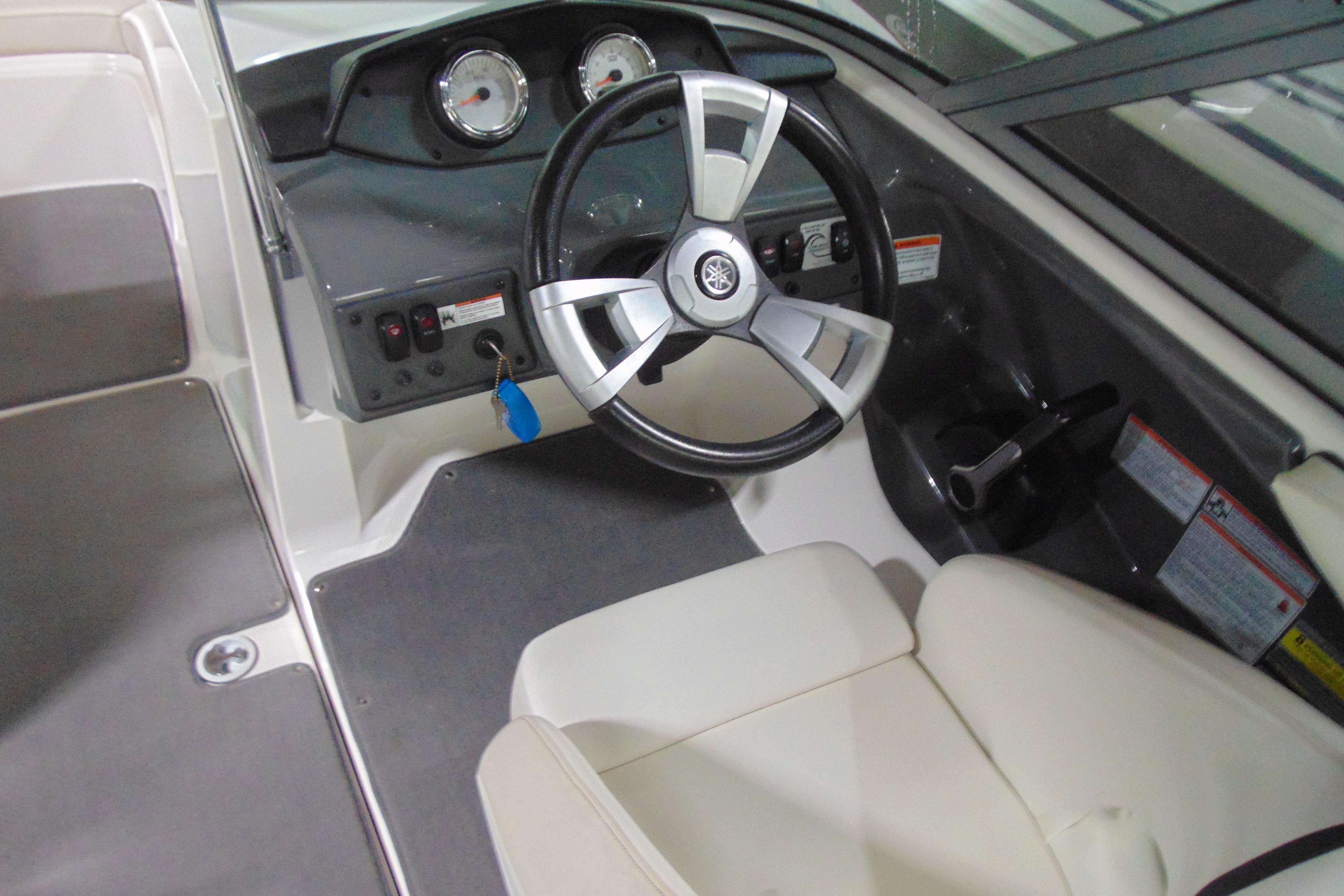 2016 Yamaha Boats AR190 cockpit with steering wheel and dashboard controls.