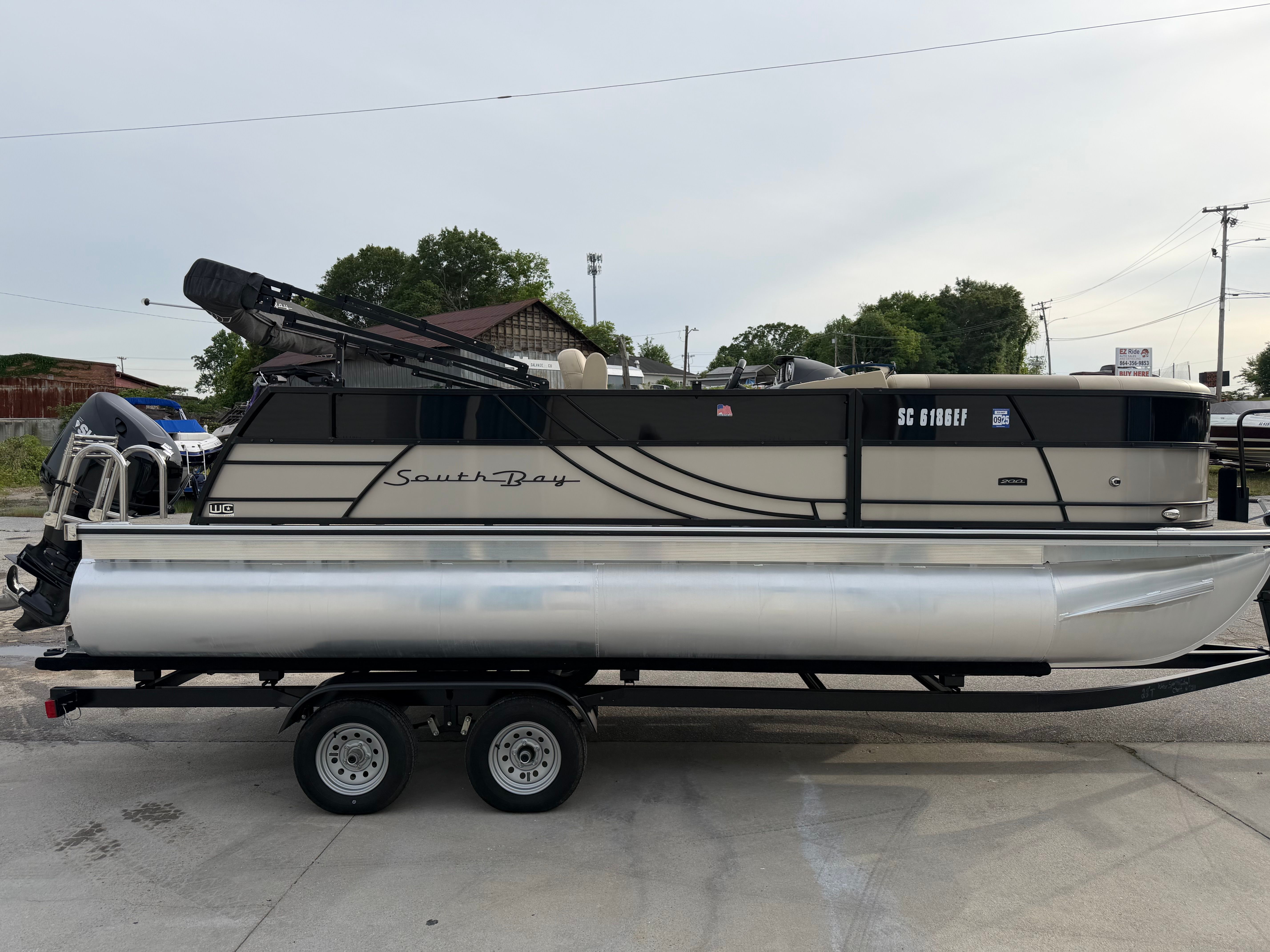 2023 South Bay S222 CR2 pontoon boat on trailer.