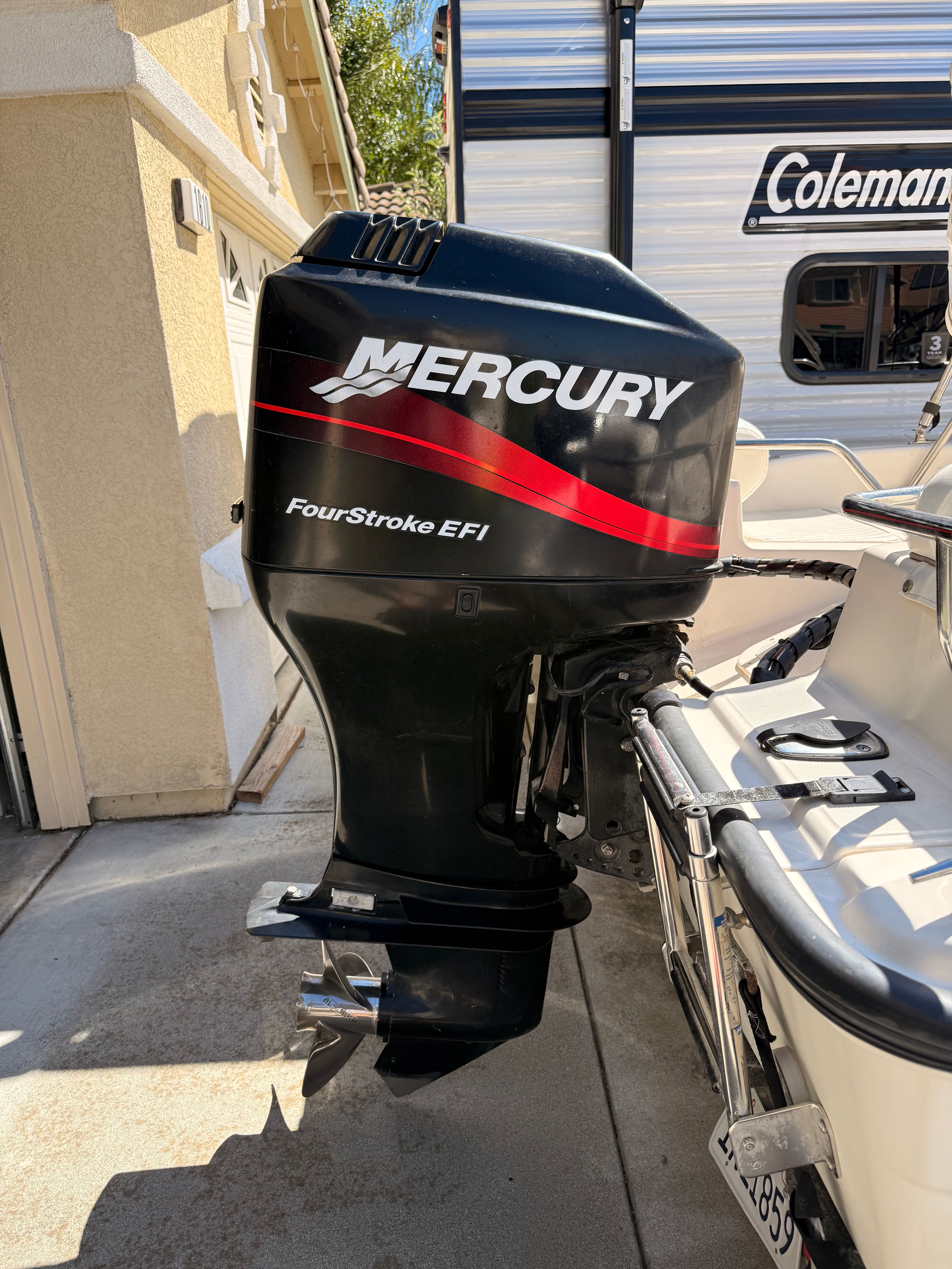 A Mercury FourStroke EFI outboard motor on a Boston Whaler 160 Dauntless boat.