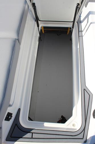 2025 Cobalt CS23 boat storage compartment, open and empty.