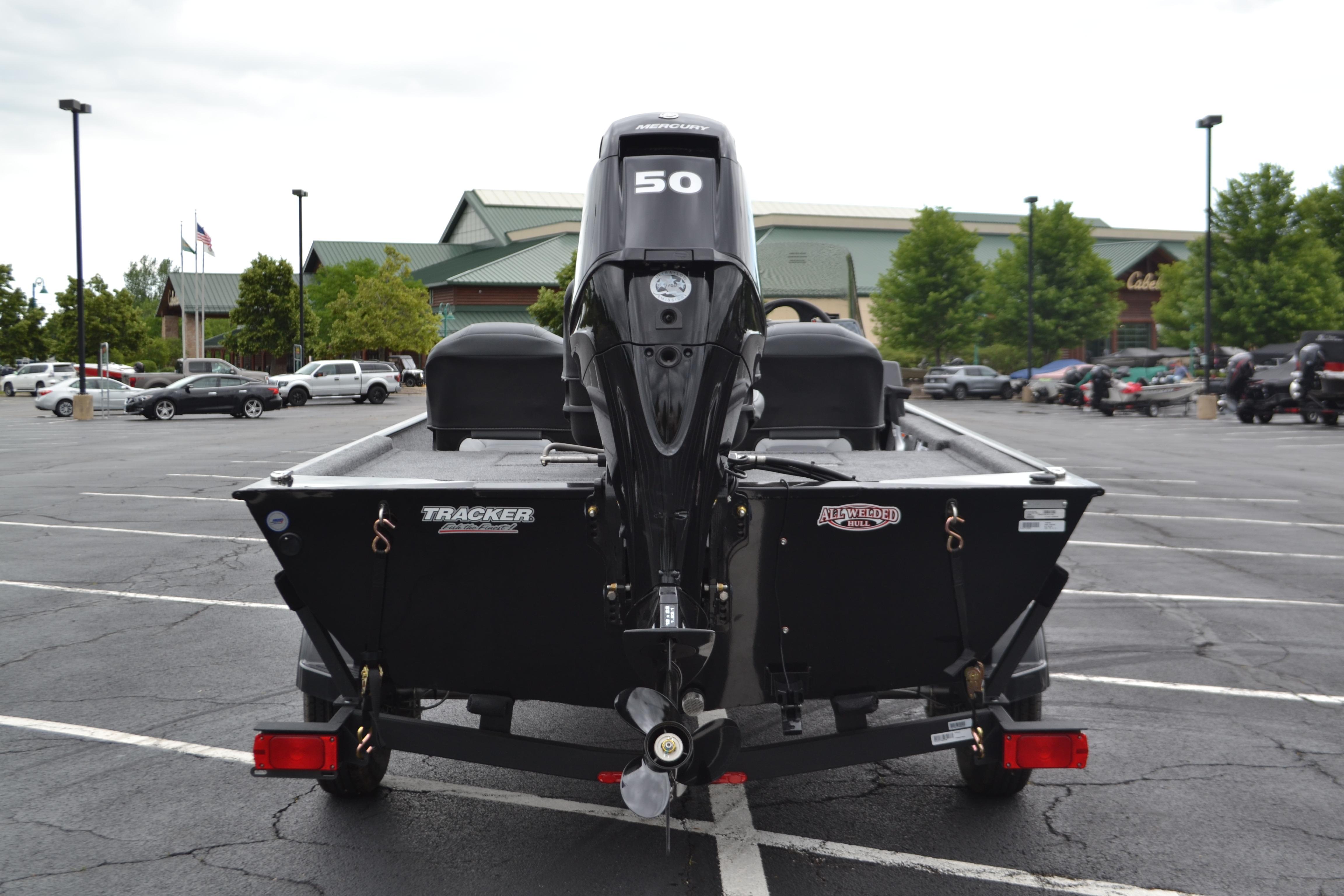 2026 Tracker Bass Tracker Classic XL boat in parking lot, rear view with motor.