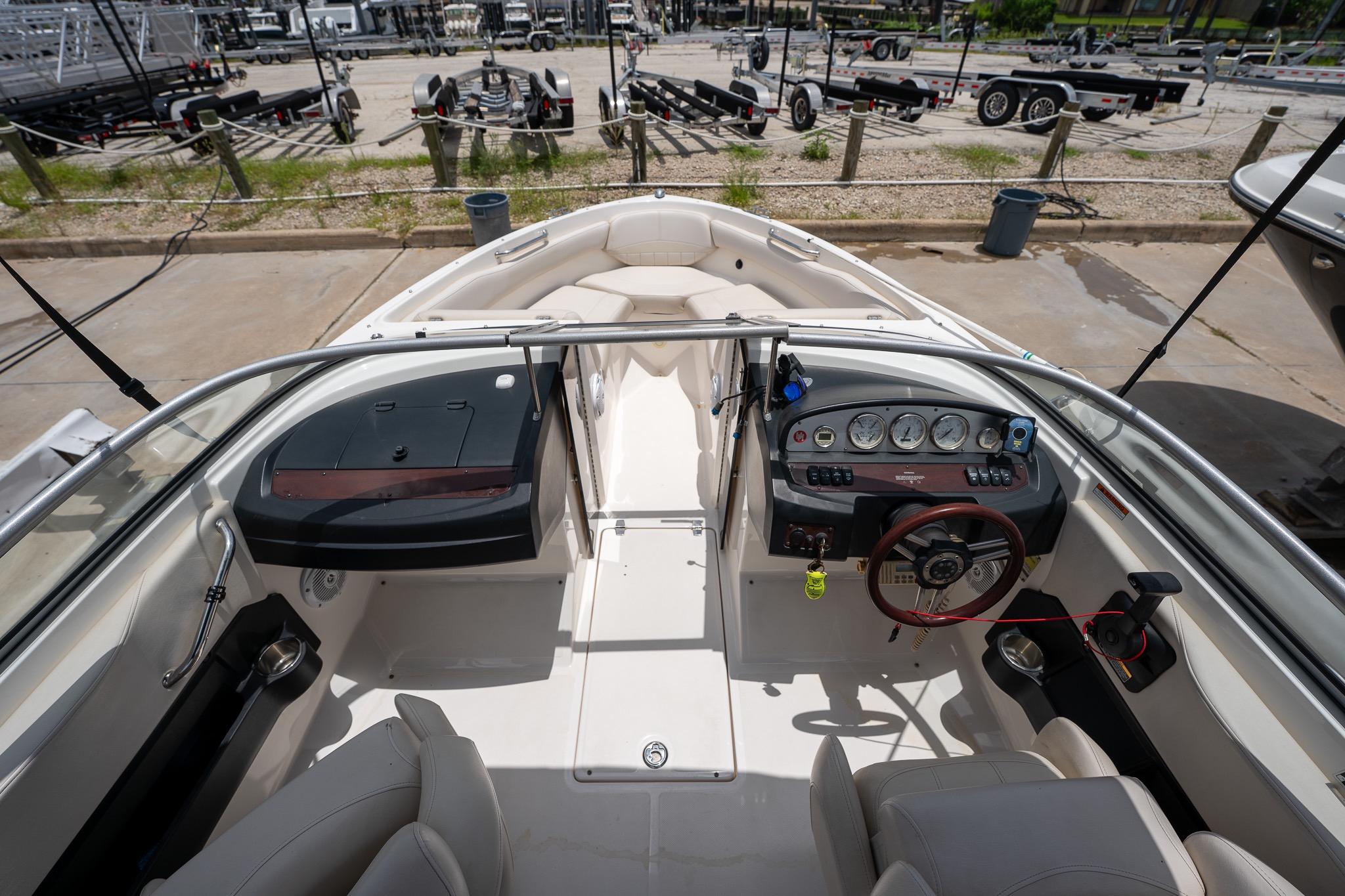 2008 Regal 2000 Bowrider boat interior with steering wheel and dashboard controls.