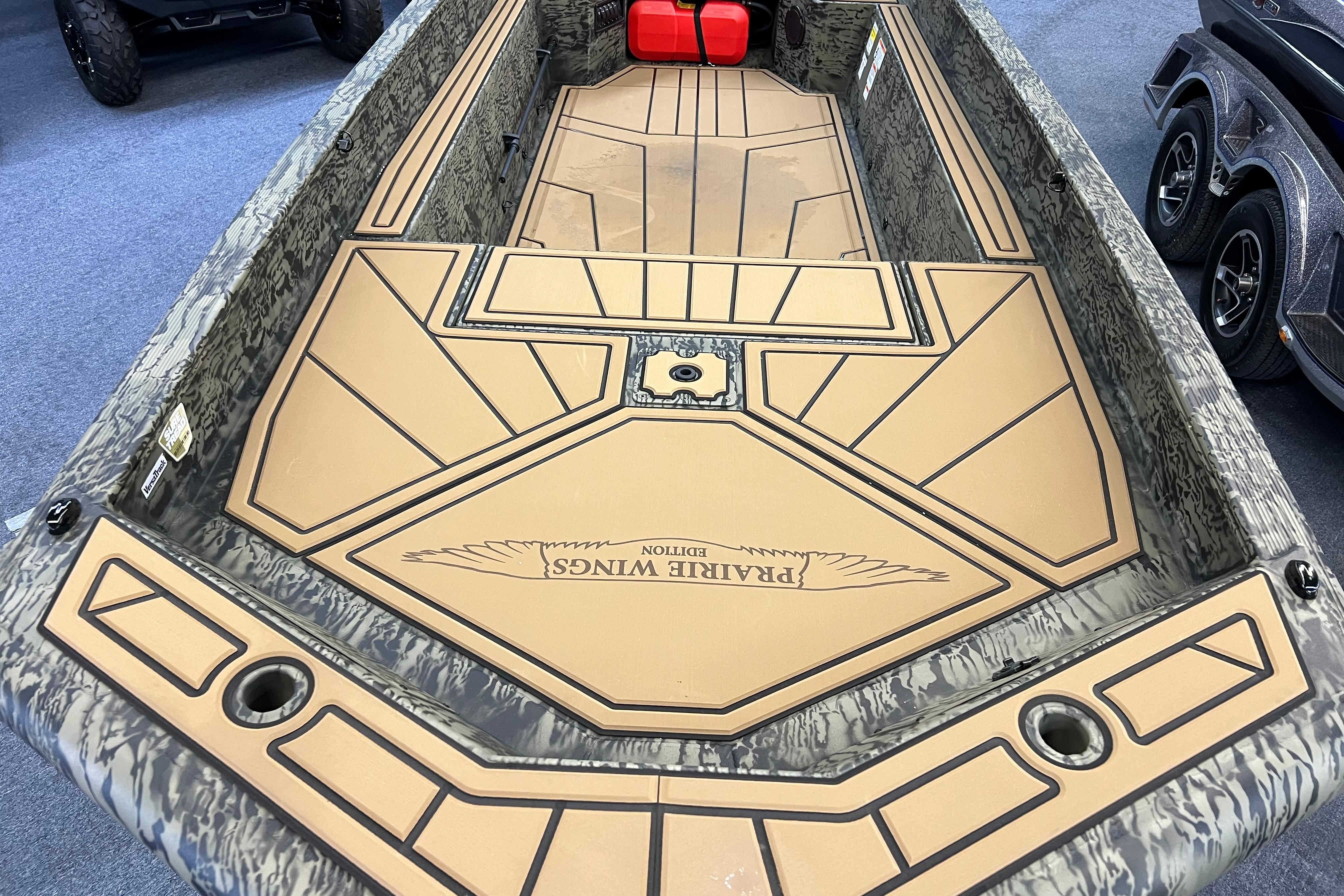 2026 Tracker Grizzly 1650 T Prairie Wings Edition boat interior with camouflage design.