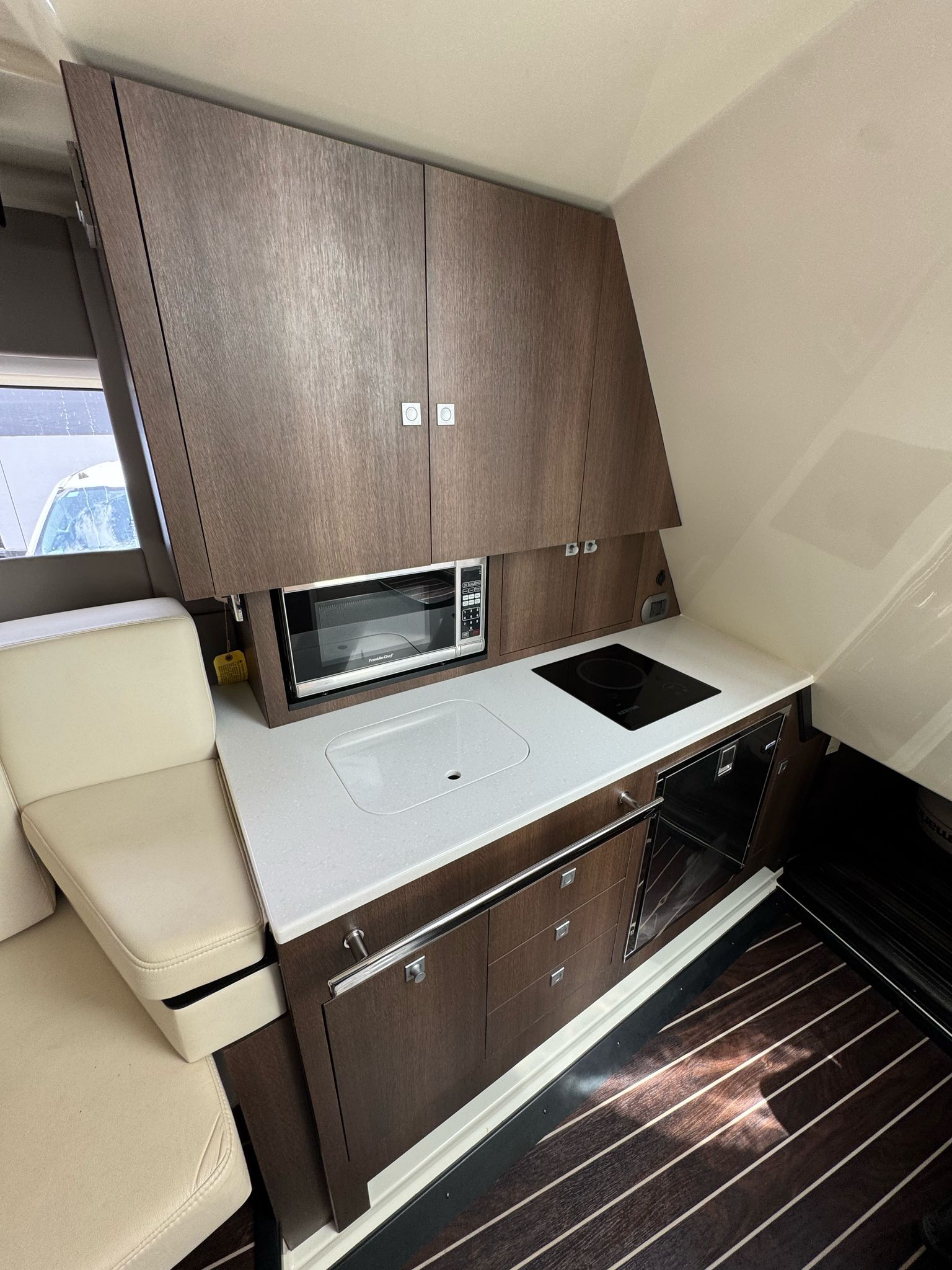 Kitchen area in a 2015 Monterey 360 Sport Coupe boat.