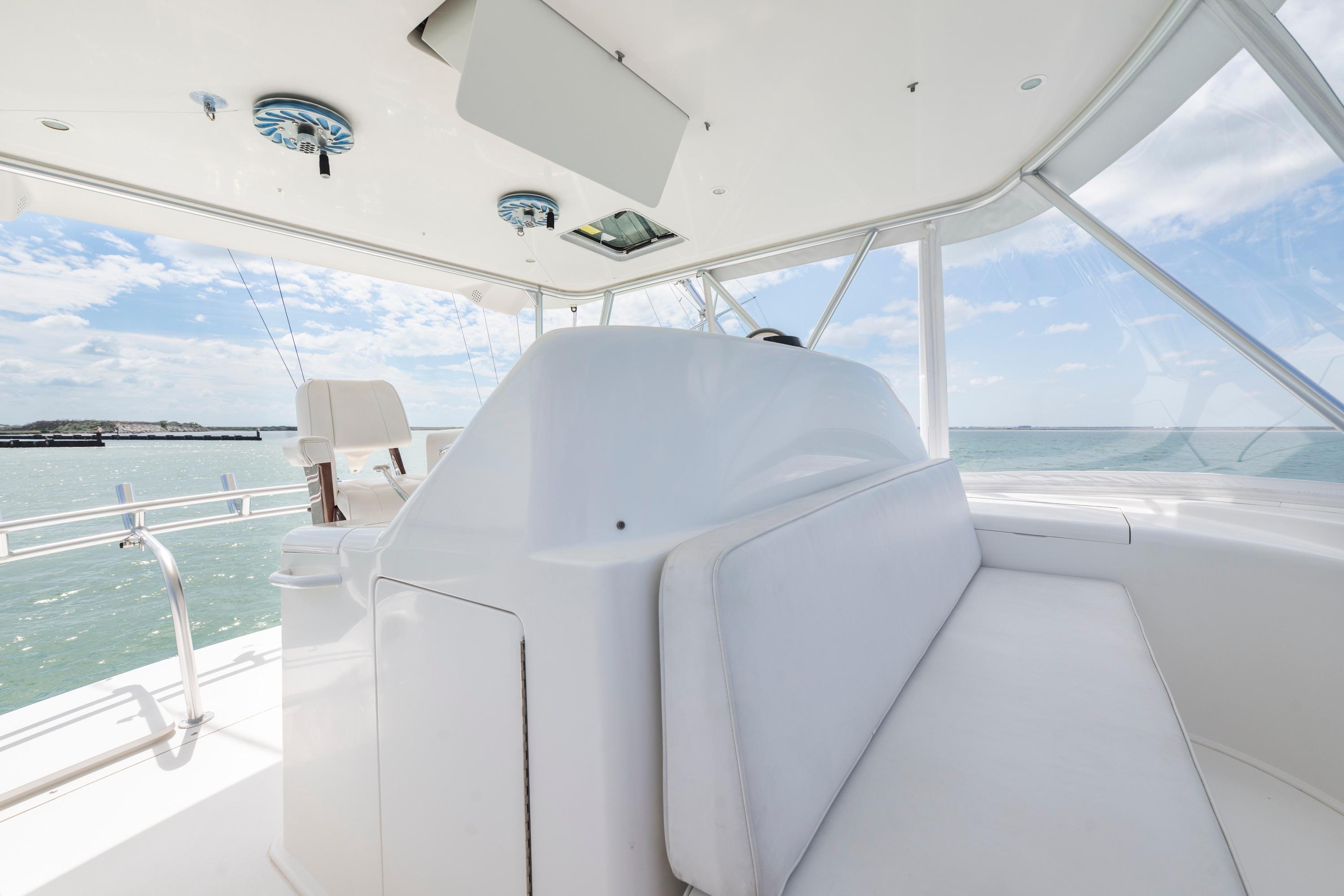 2009 Viking 50 Convertible yacht interior with white seating and ocean view.