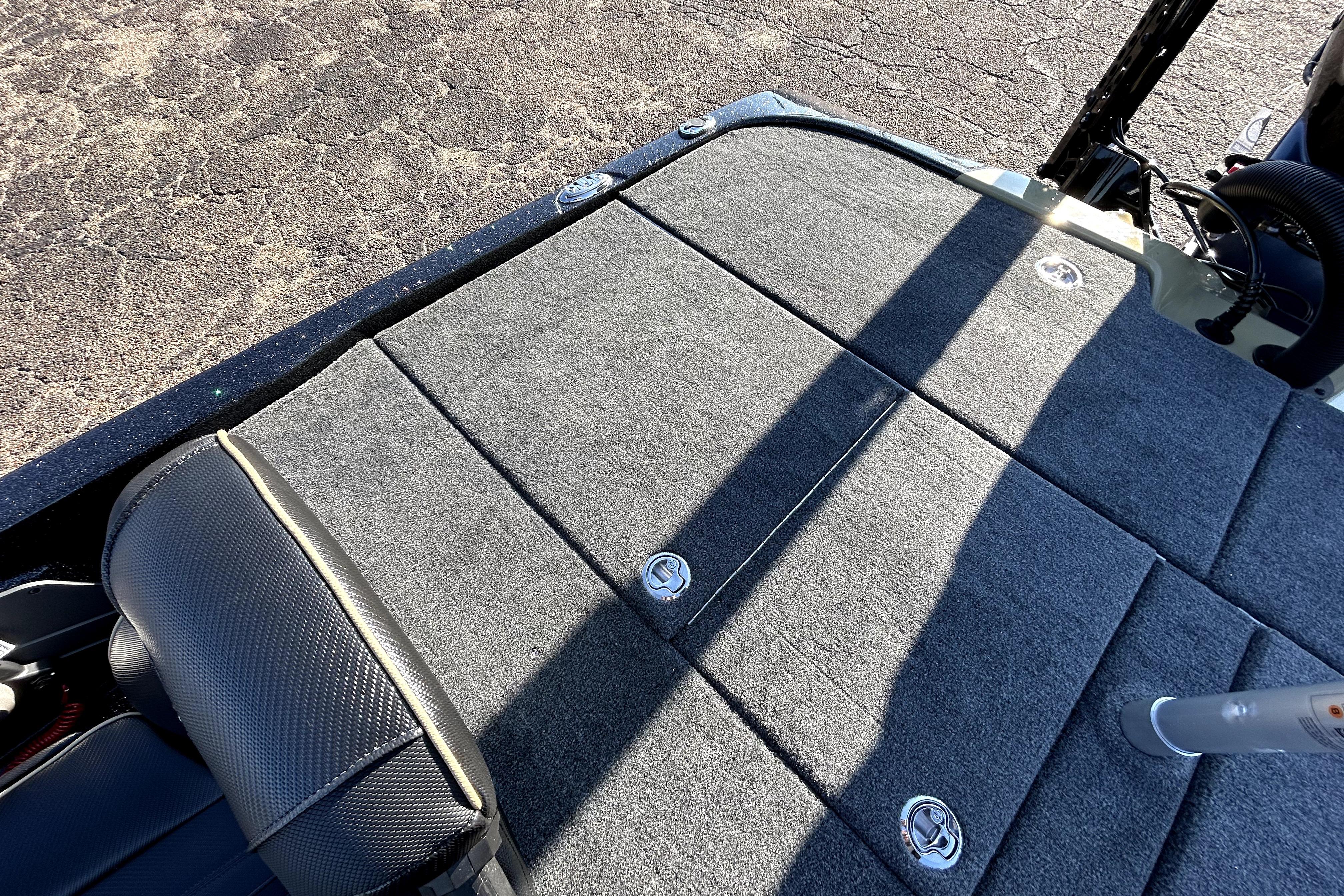 2026 Skeeter ZXE21 boat deck with carpeted surface and storage compartments.