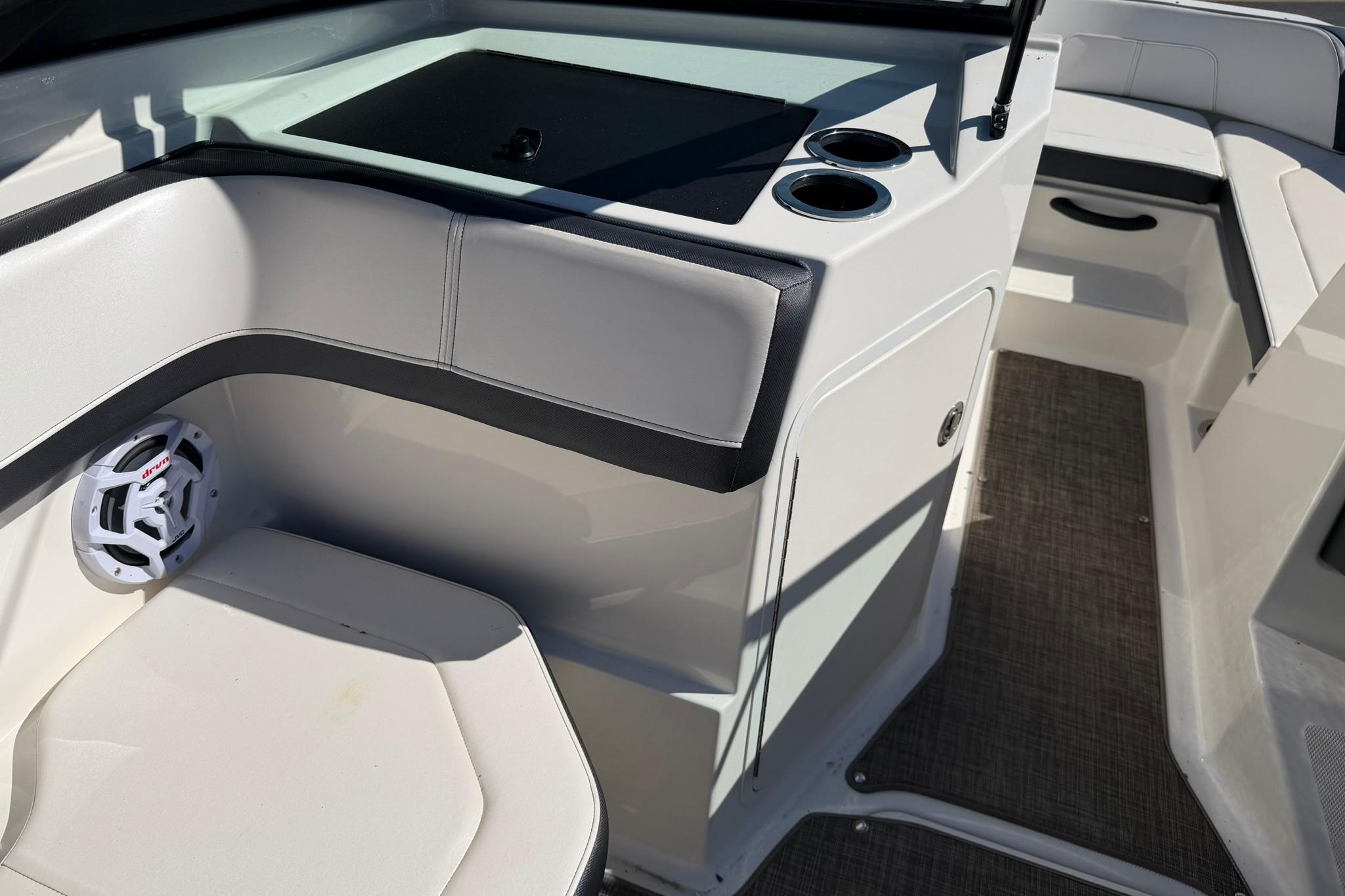 Interior of a 2016 Sea Ray SPX 210 boat with seating and cup holders.