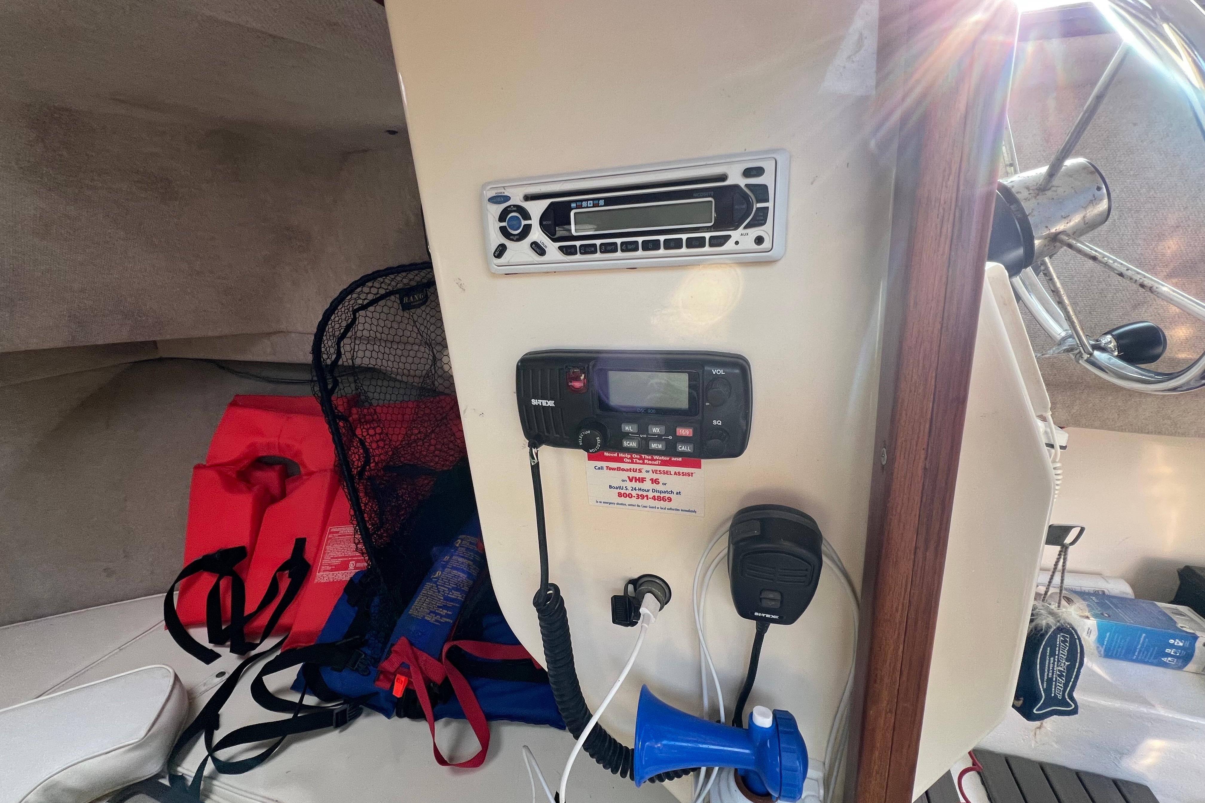 Interior of 2001 Parker 2520 Deep Vee Sport Cabin with radio and safety gear.