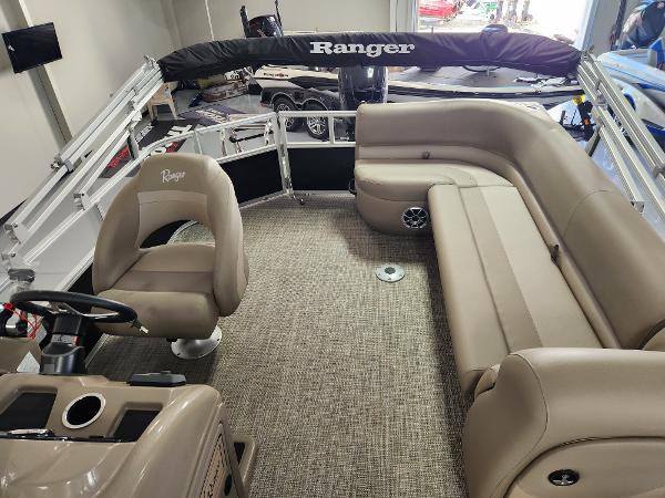 2025 Ranger 200C boat interior with beige seating and steering console.
