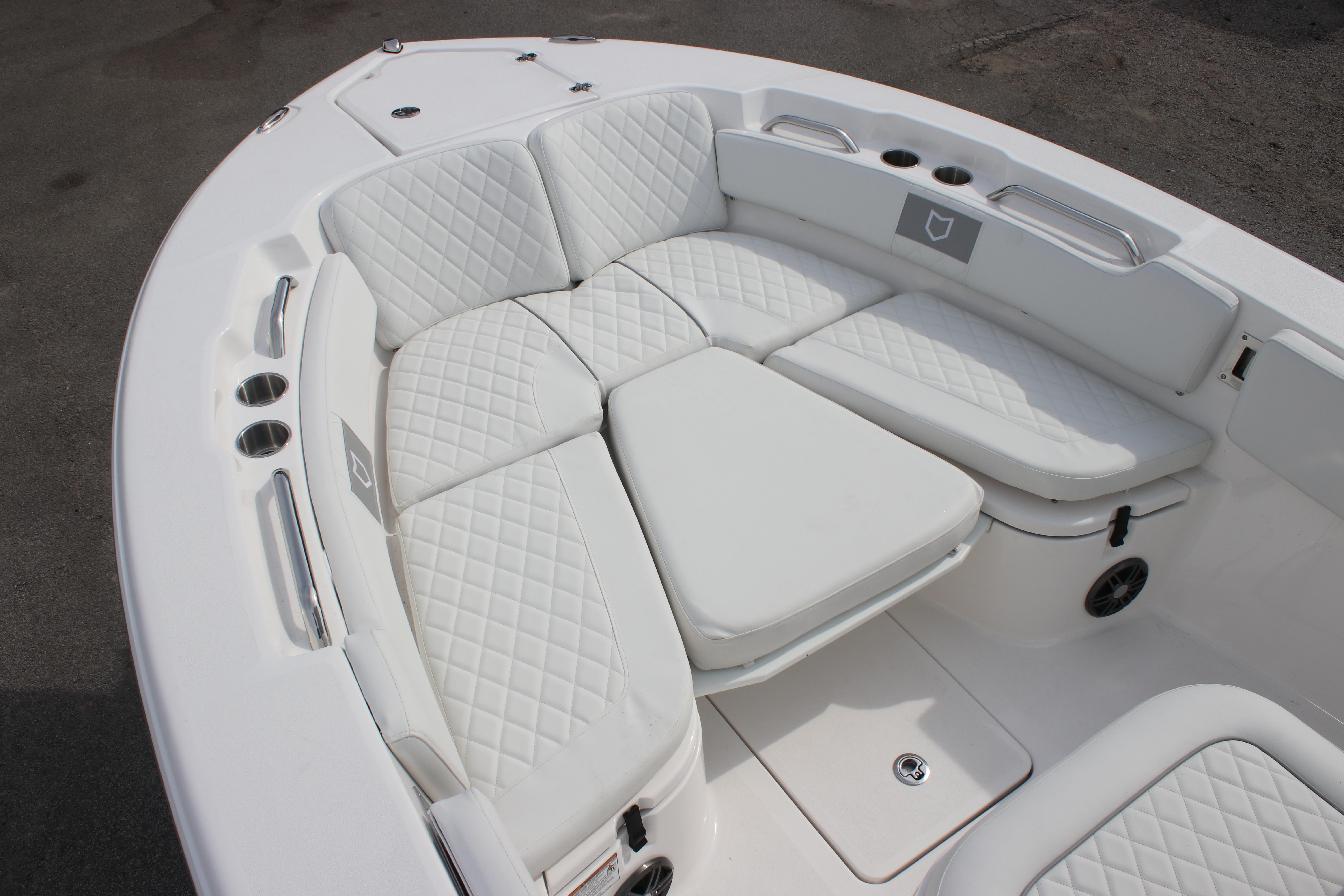 2026 Sea Fox 248 Commander boat with luxurious white seating and cup holders.