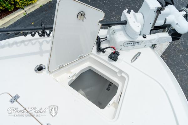 2025 Caymas 281 HB boat deck with storage compartment and Minn Kota trolling motor.