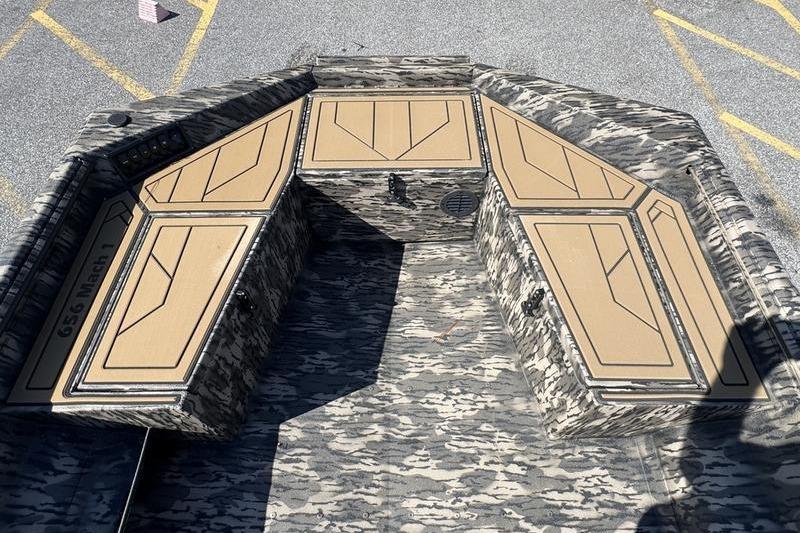 2026 Havoc 1656 MRST MACH 1 boat interior with camouflage design and storage compartments.