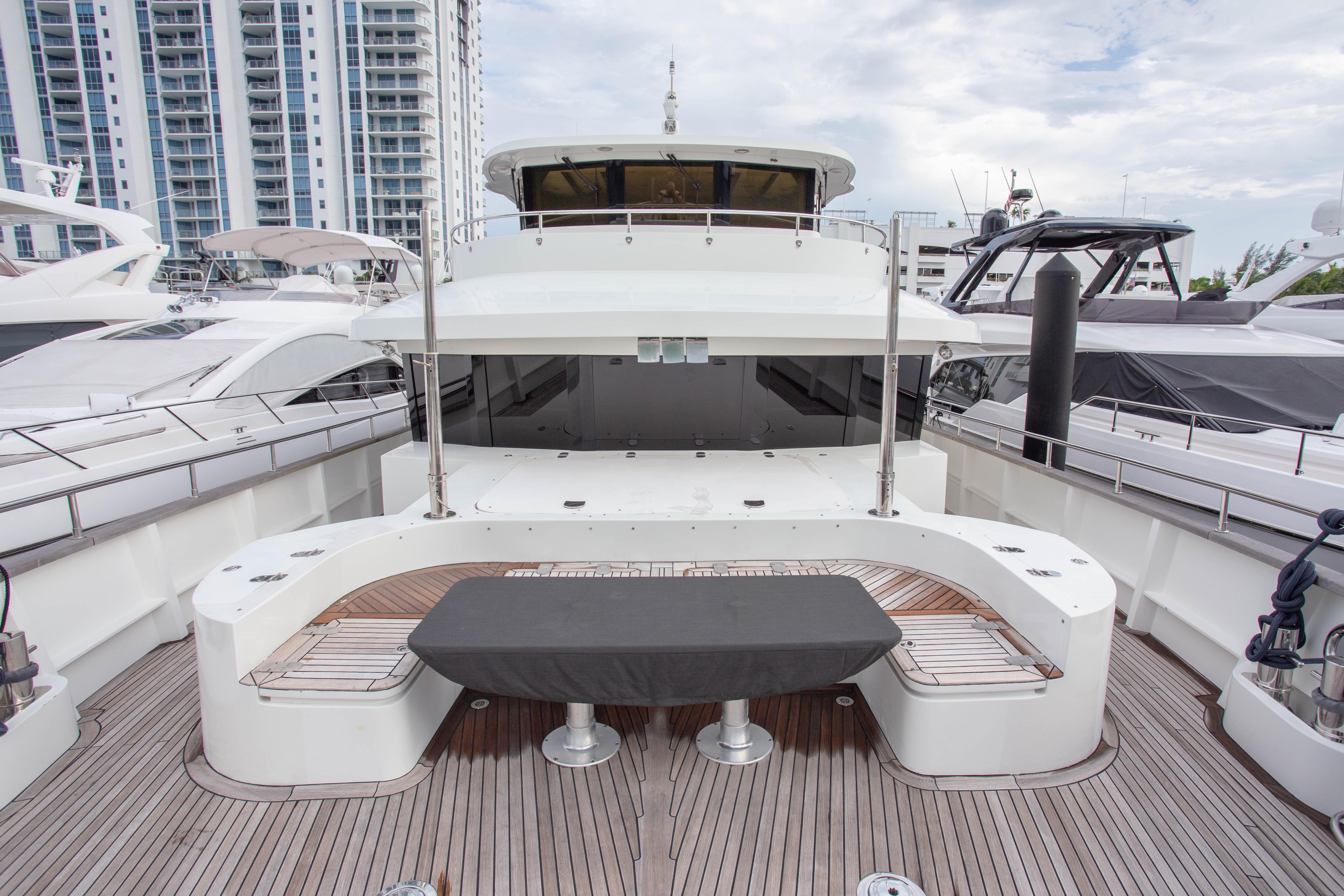 Luxurious 2014 Fifth Ocean Yachts 24m Explorer Yacht docked, showcasing spacious deck and modern design.