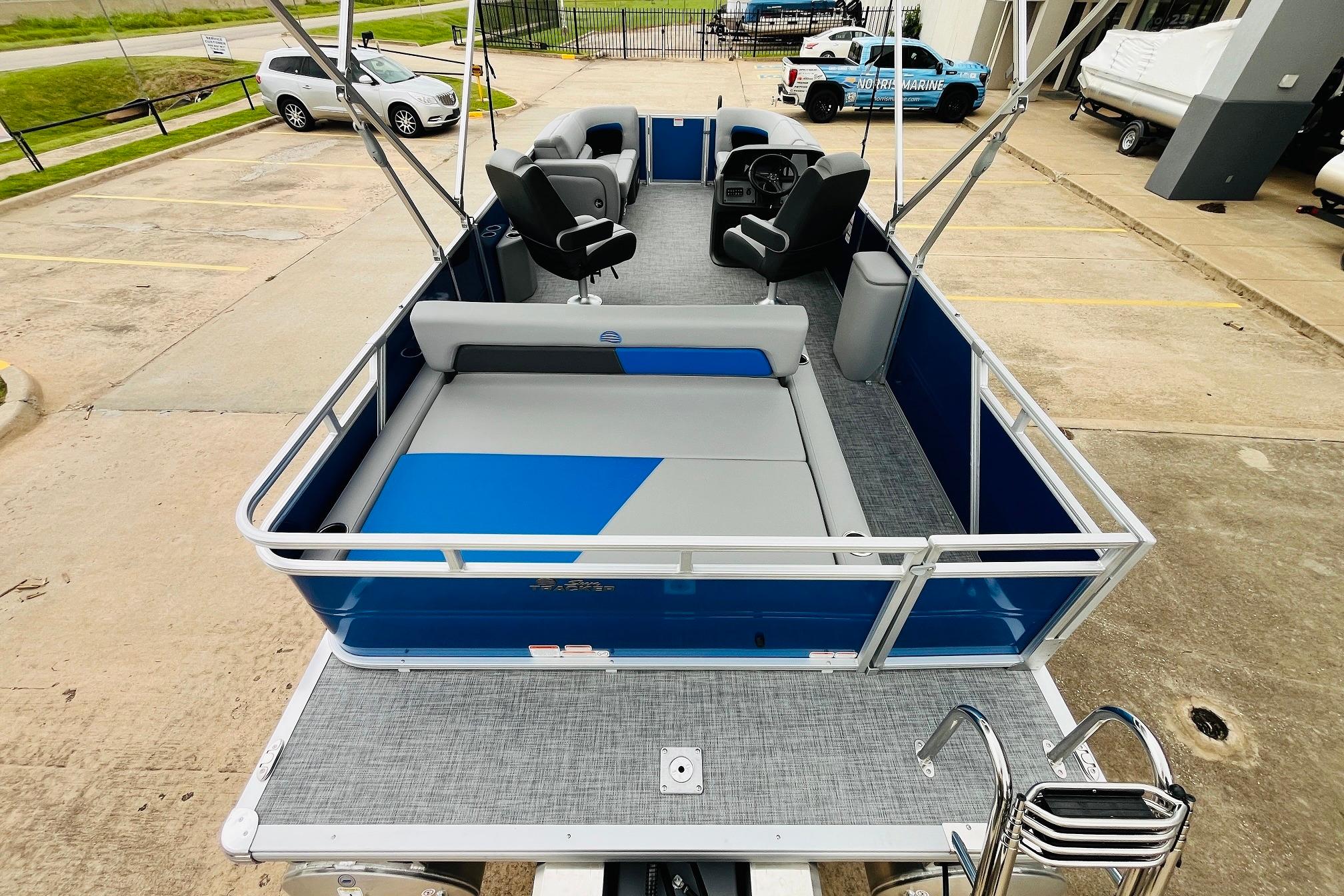 2026 Sun Tracker Party Barge 22 RF DLX pontoon boat with spacious seating and modern design.