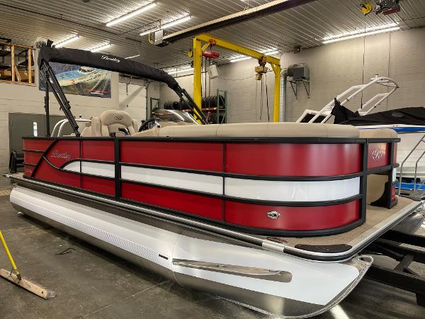 2025 Bentley Pontoons 200 Fish-N-Cruise in a showroom, featuring a sleek red and white design.