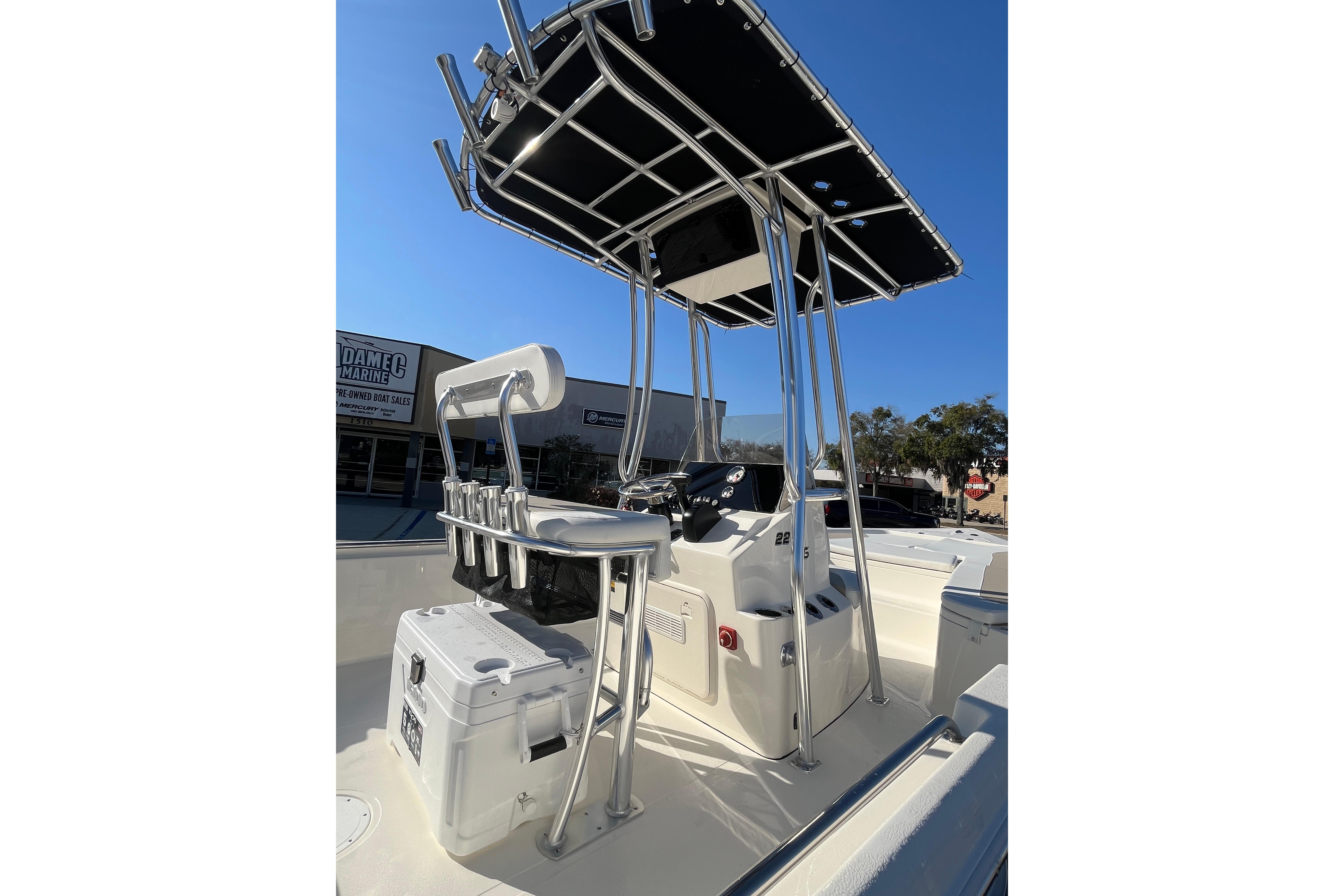 2026 Bulls Bay 2200 boat with T-top and console, parked outdoors.