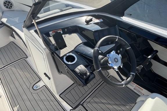 2026 Yamaha Boats 222S cockpit with steering wheel and modern controls.