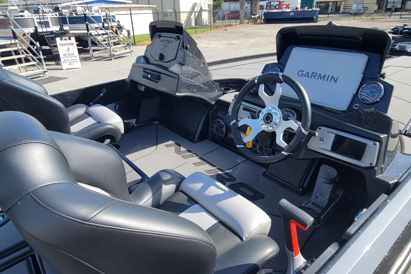 2026 Nitro Z20 XL Pro boat interior with Garmin navigation system and sleek black seating.
