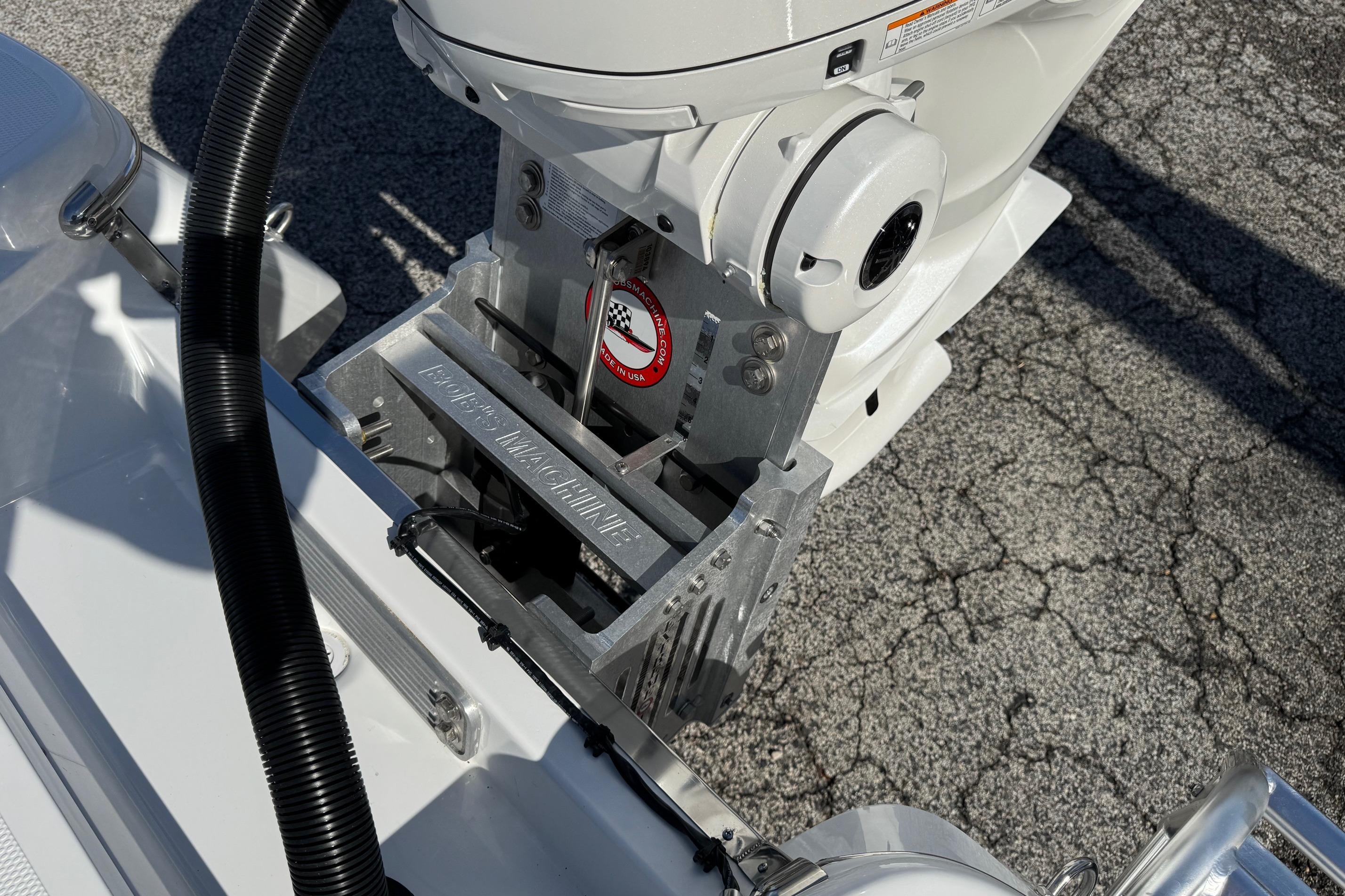 2026 BlackJack 256 Bay boat engine mount detail on textured surface.