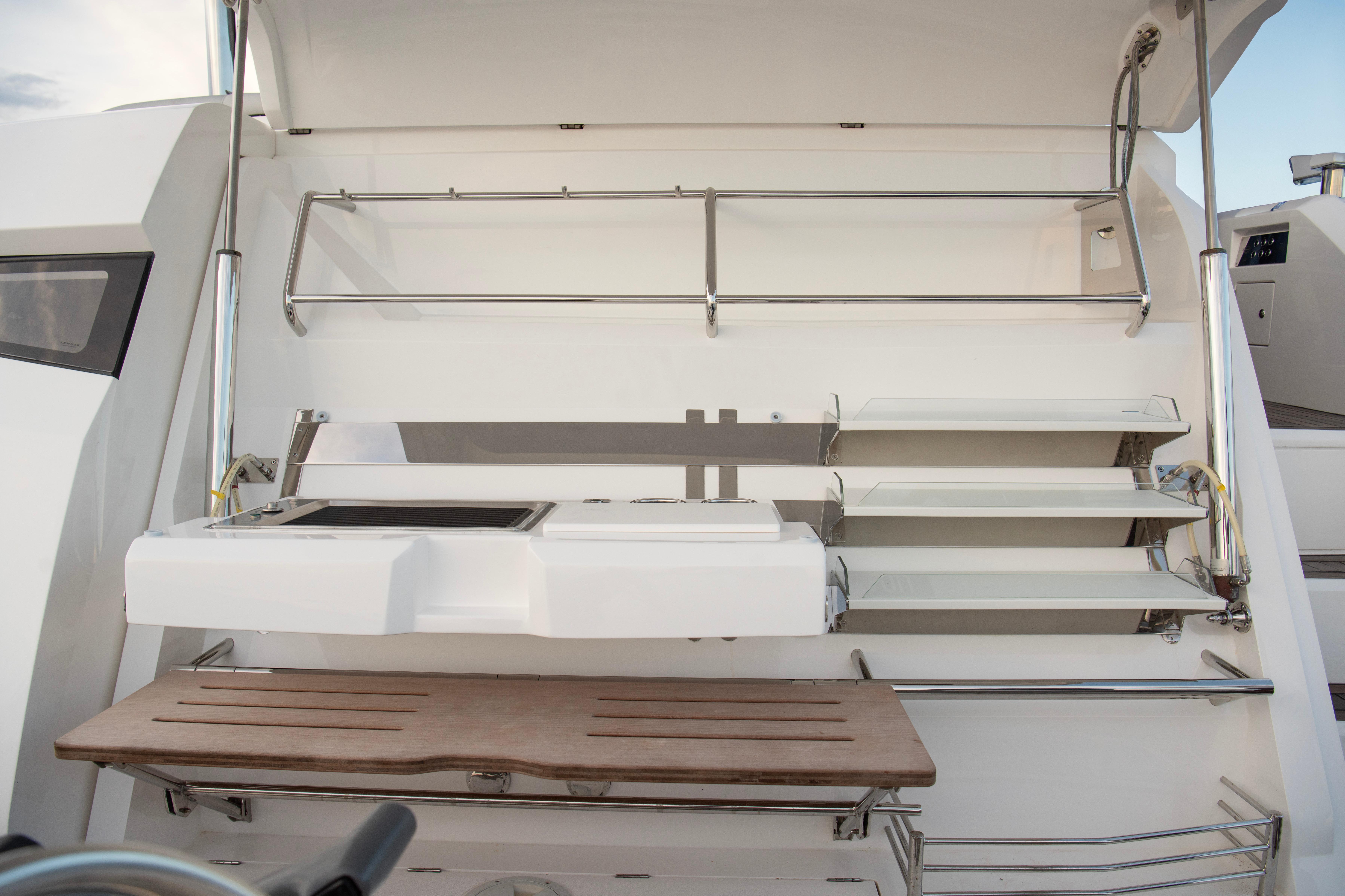 Sunseeker Manhattan 68 yacht's sleek outdoor kitchen area, 2022 model.
