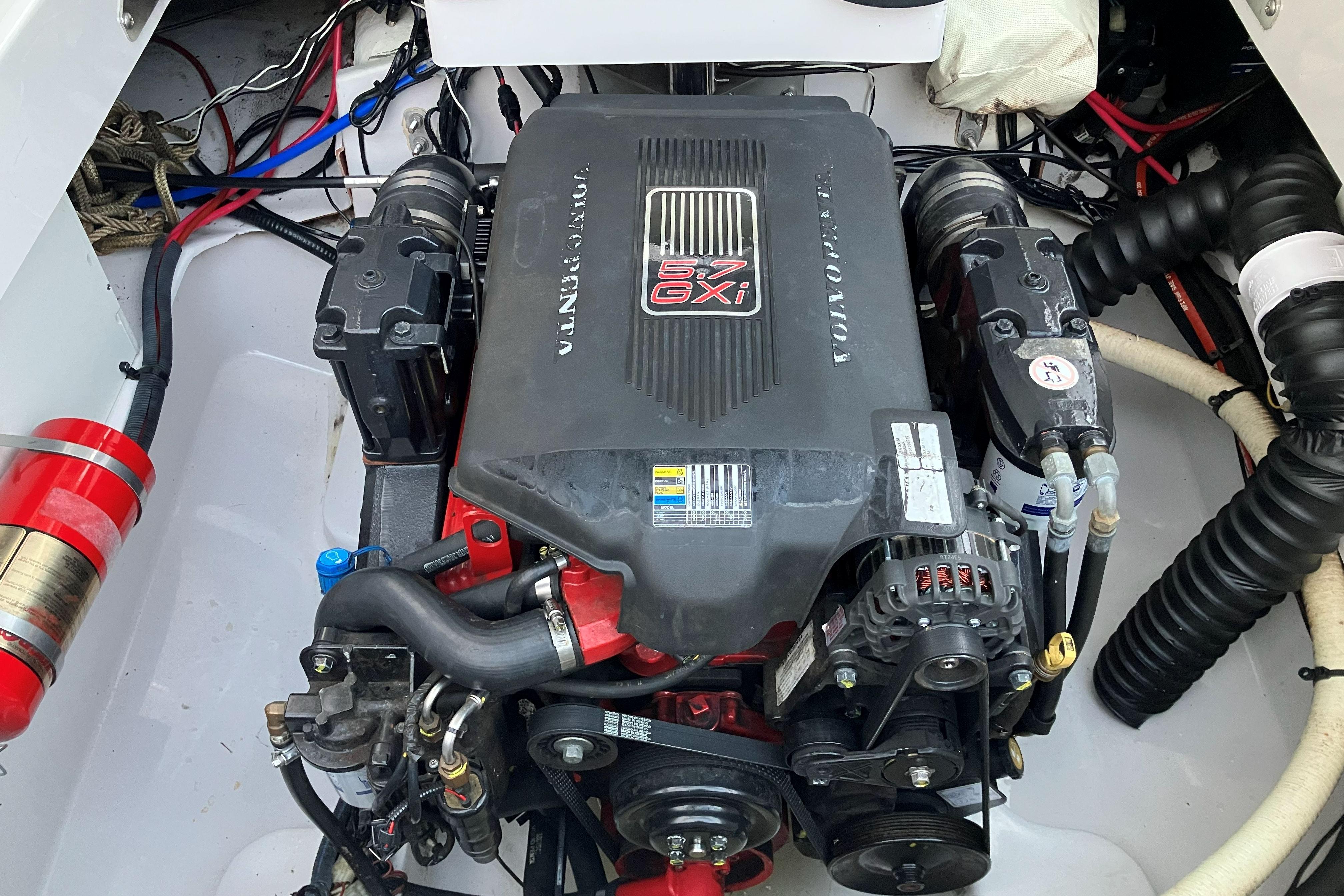 Engine compartment of a 2006 Four Winns 240 Horizon boat, featuring a Volvo Penta 5.7 GXI engine.