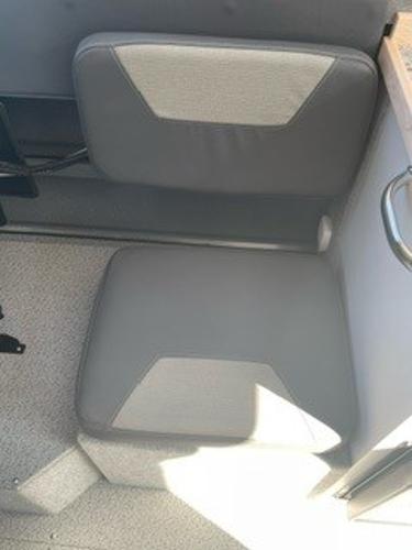 Gray seating in a 2025 Spartan 2600 Olympia boat interior.