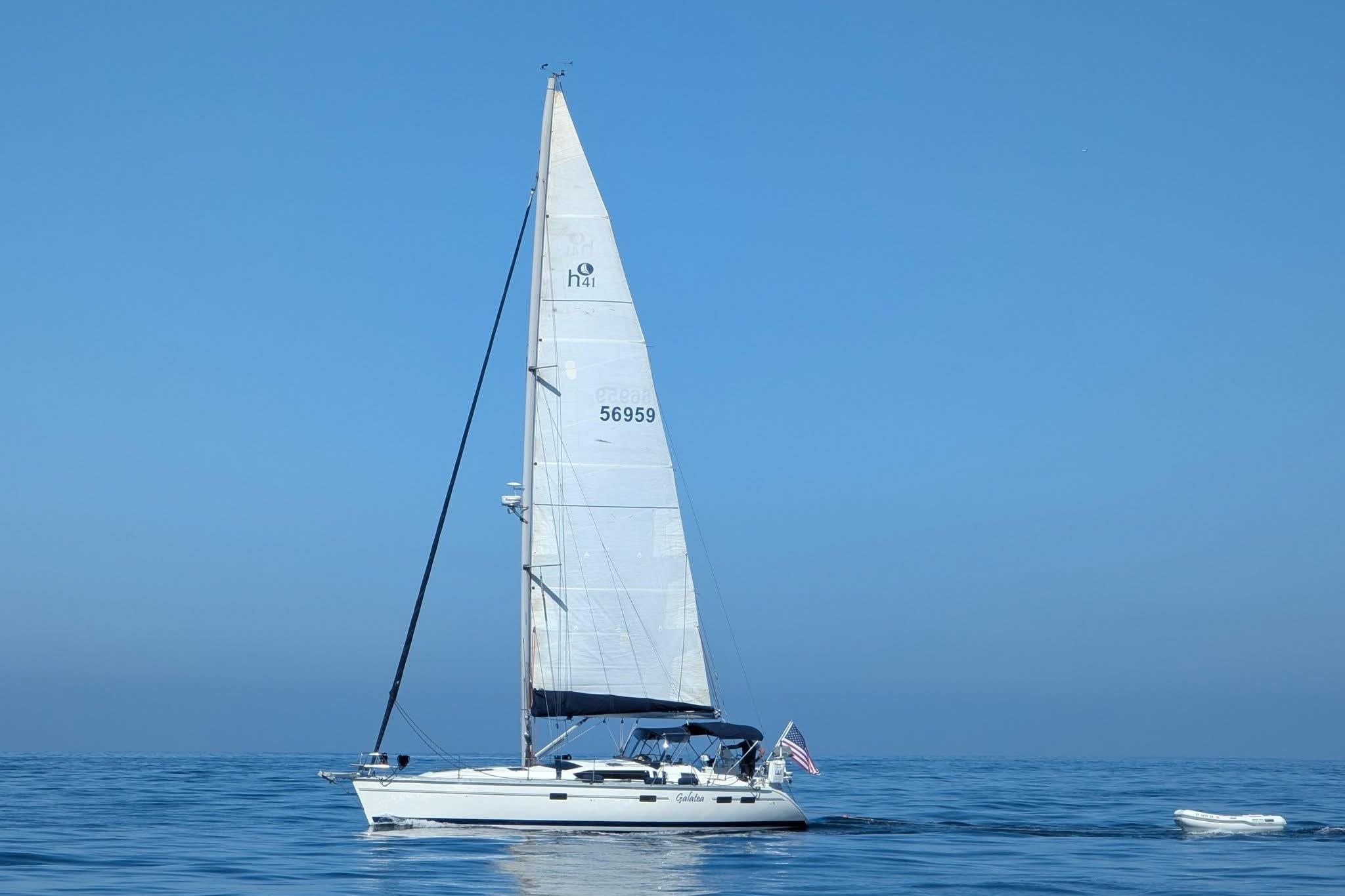 Sailboat Hunter Legend 40.5 (1997) on calm ocean under clear blue sky.