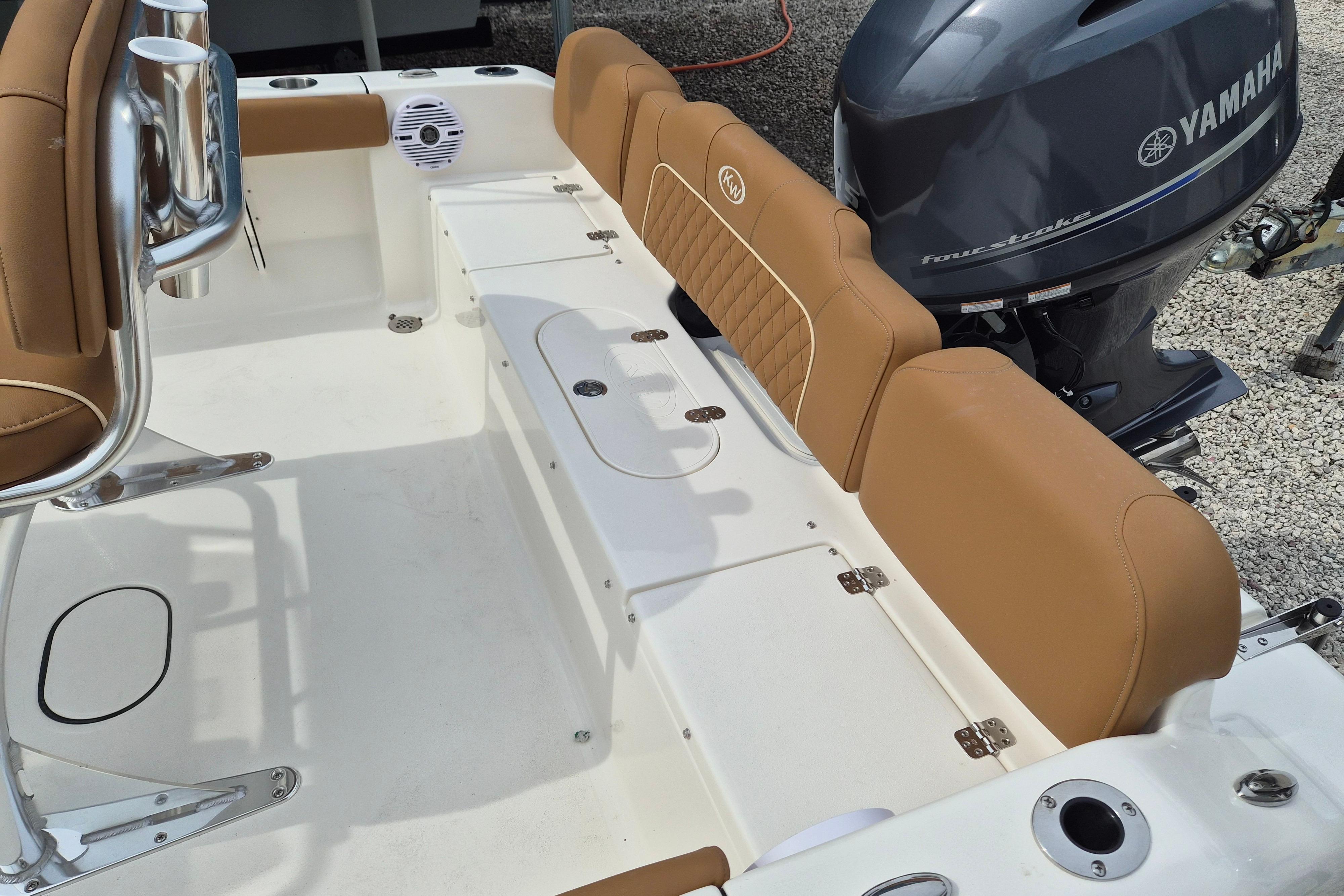 2026 Key West 189 FS boat interior with tan seating and Yamaha engine.