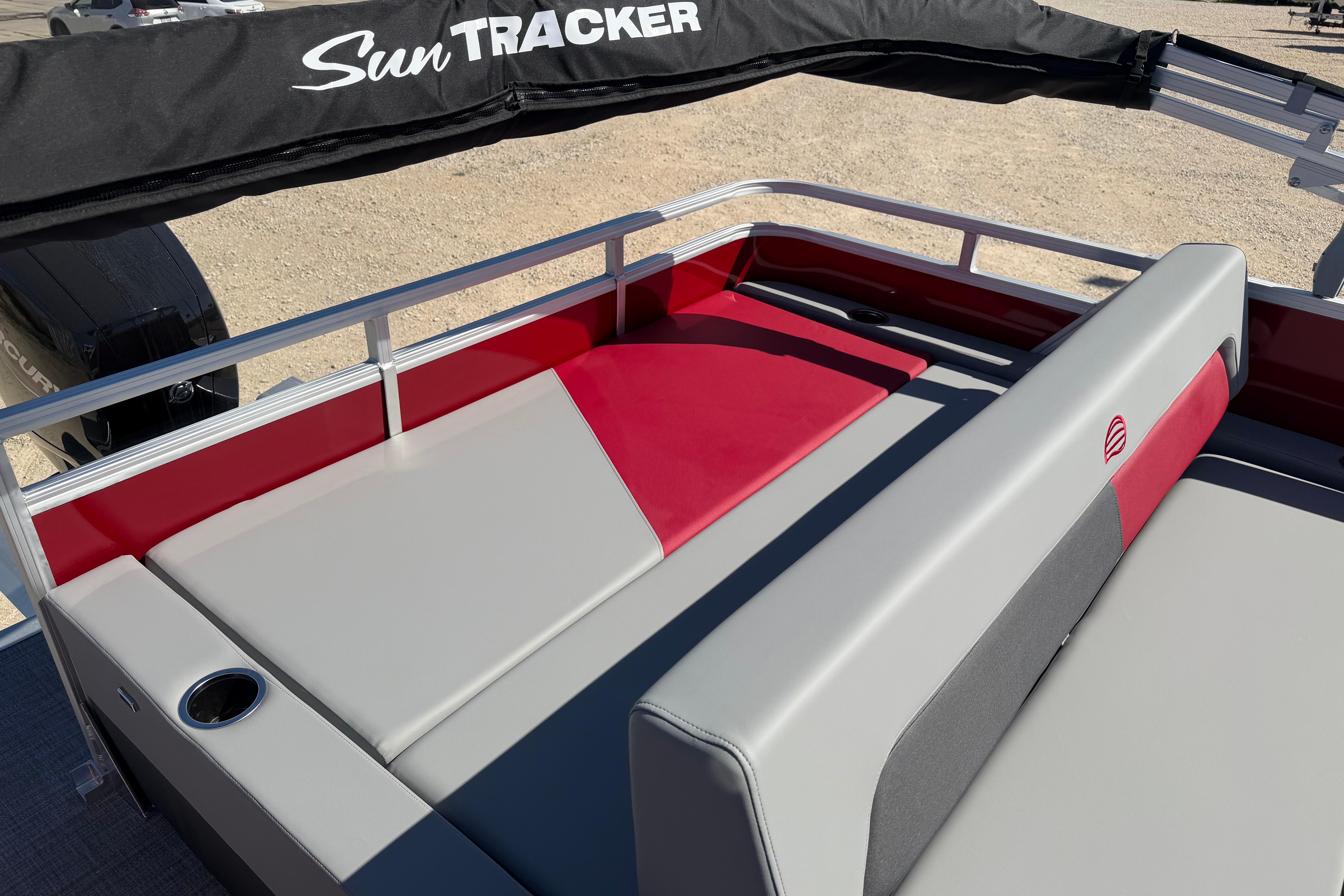 2026 Sun Tracker Party Barge 22 RF XP3 with red and gray seating.
