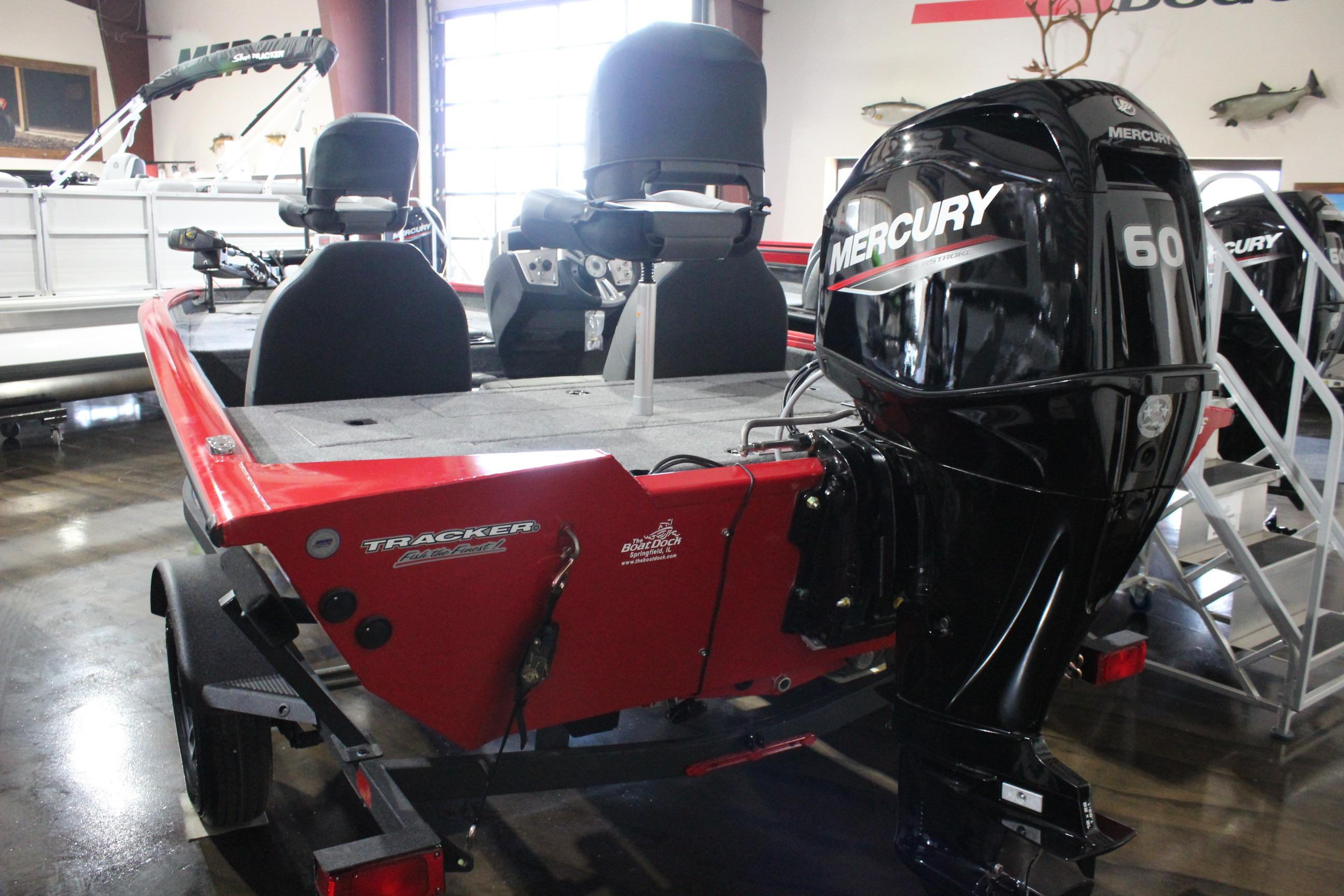 2026 Tracker Pro Team 175 boat with Mercury 60 engine in showroom.