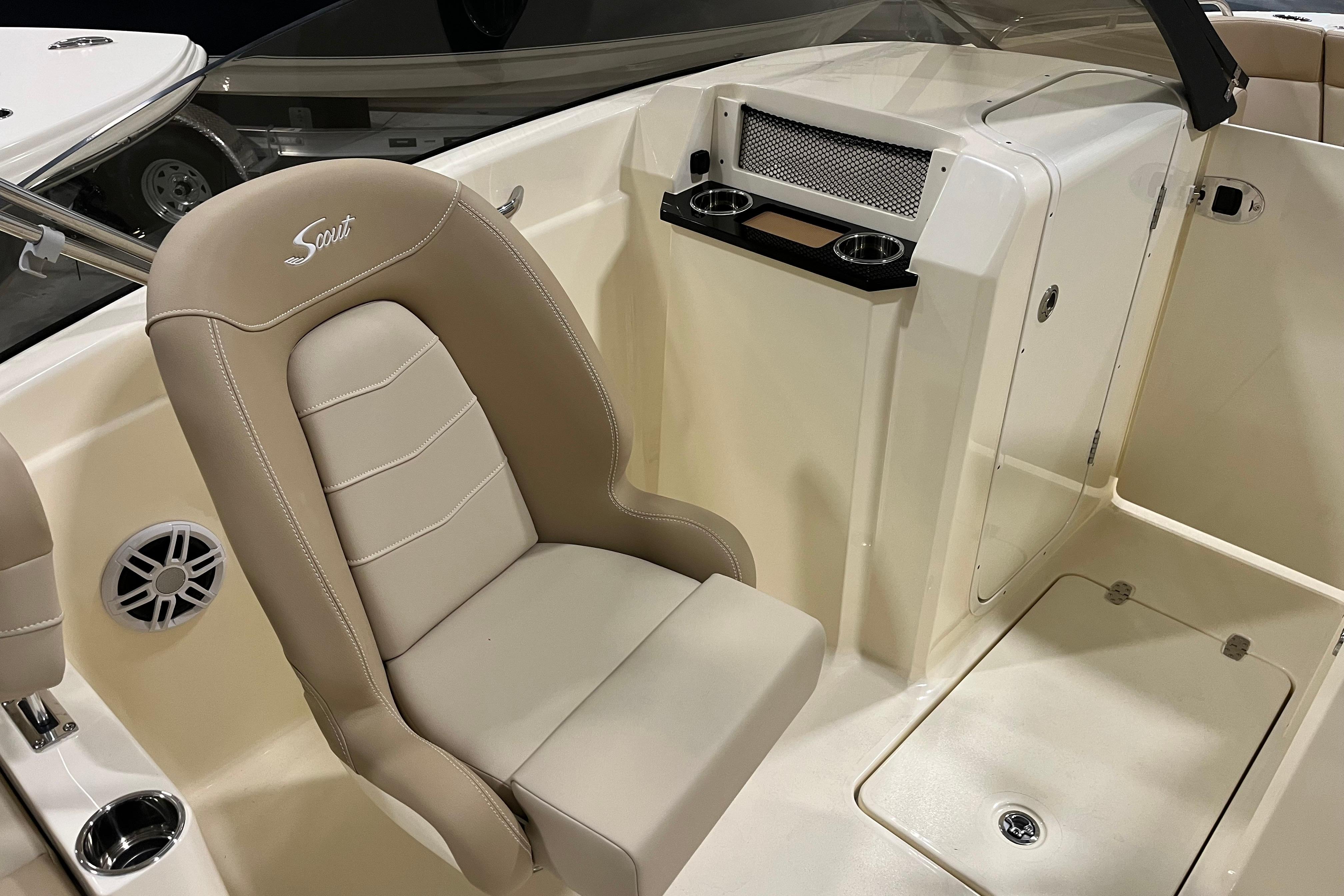 2025 Scout 215 Dorado boat interior with beige seating and console features.