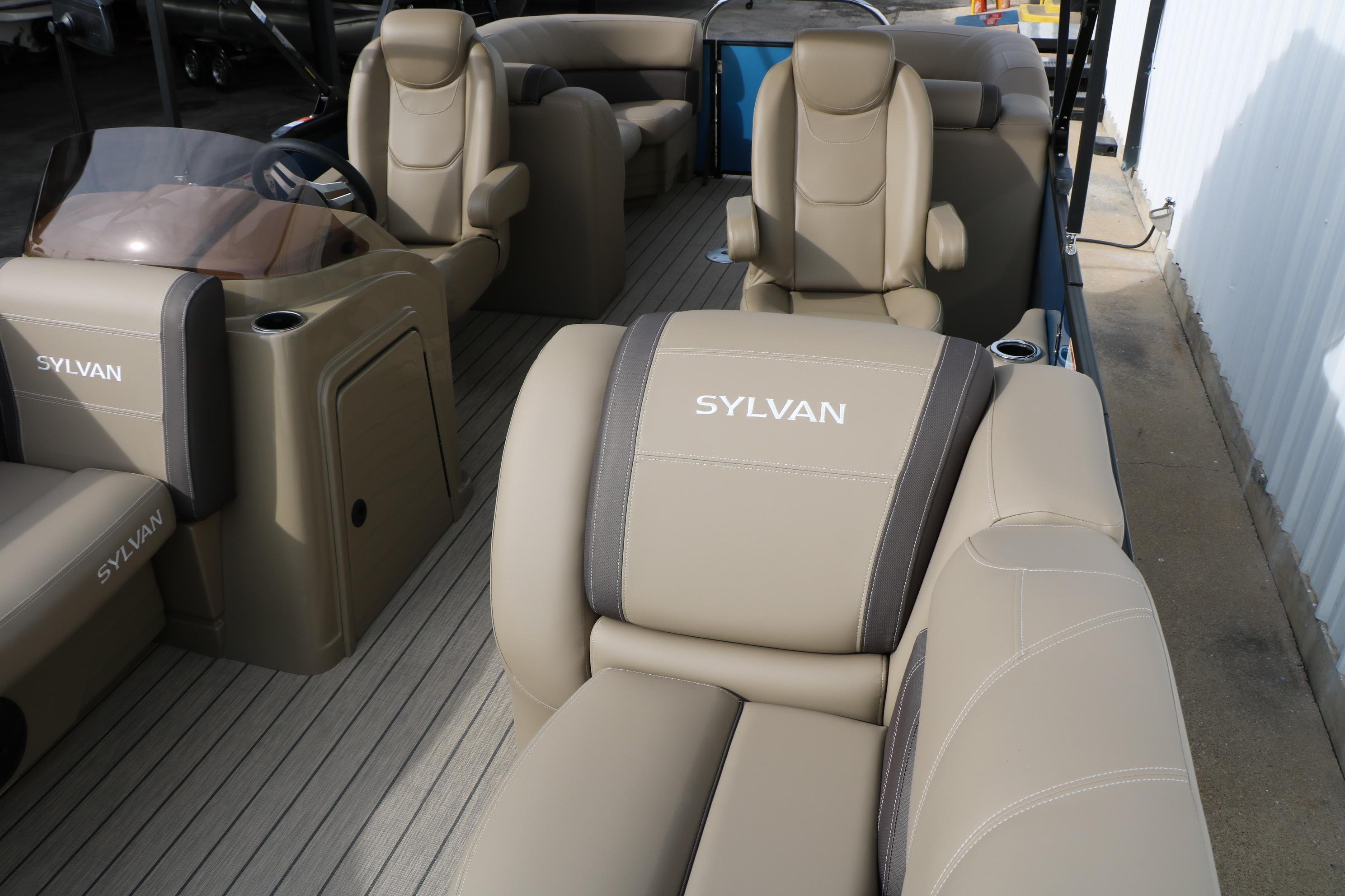2026 Sylvan Mirage 822 LZ pontoon boat with beige seating and steering console.