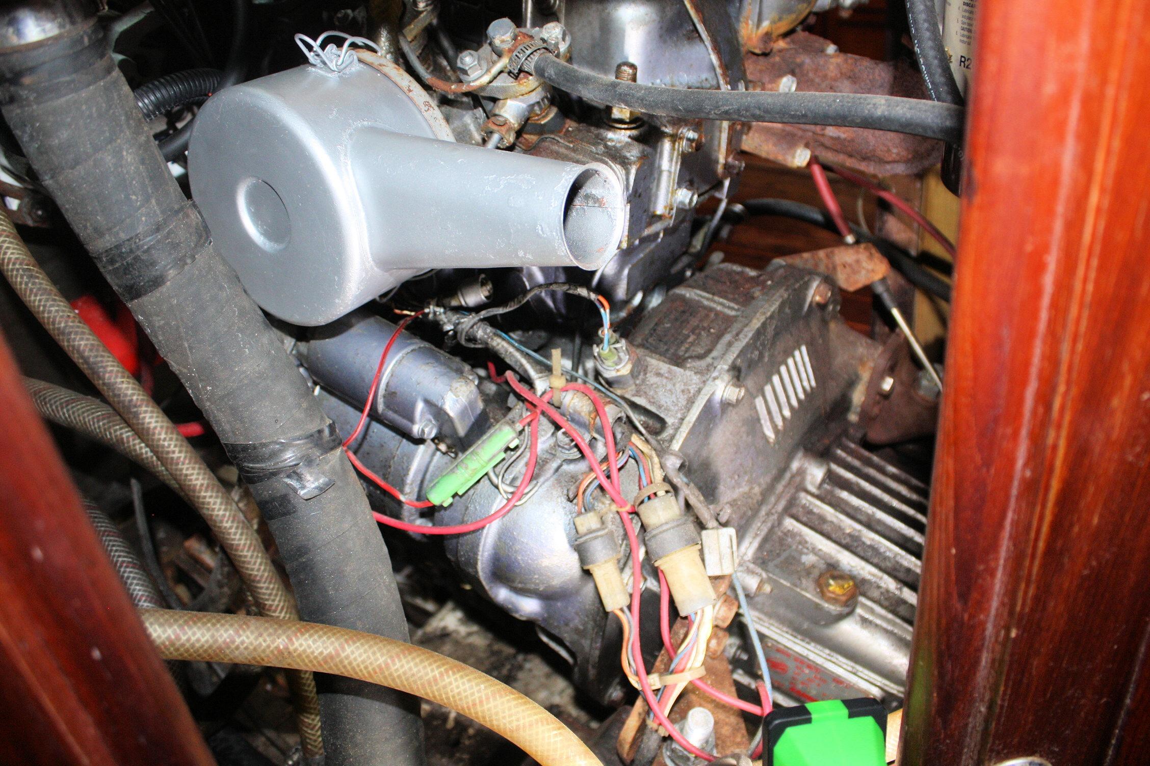 Engine compartment of a 1987 Ericson 38-200 sailboat, showing wiring and components.