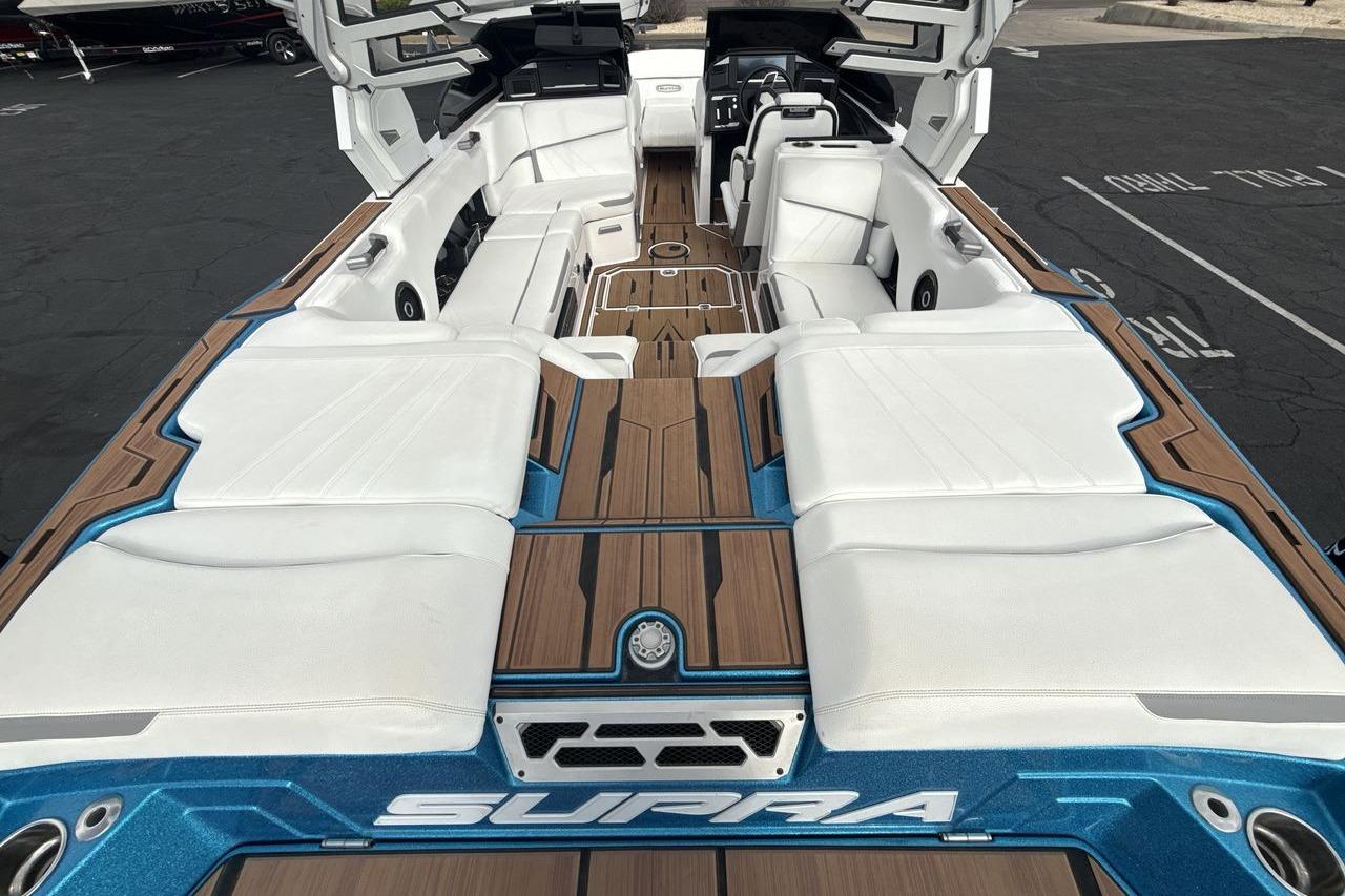 2024 Supra SA 550 boat interior with luxurious white seating and sleek design.