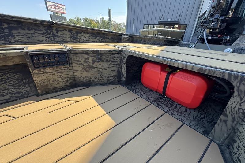 2026 Tracker Grizzly 1756 T Marsh boat interior with red fuel tank and control panel.