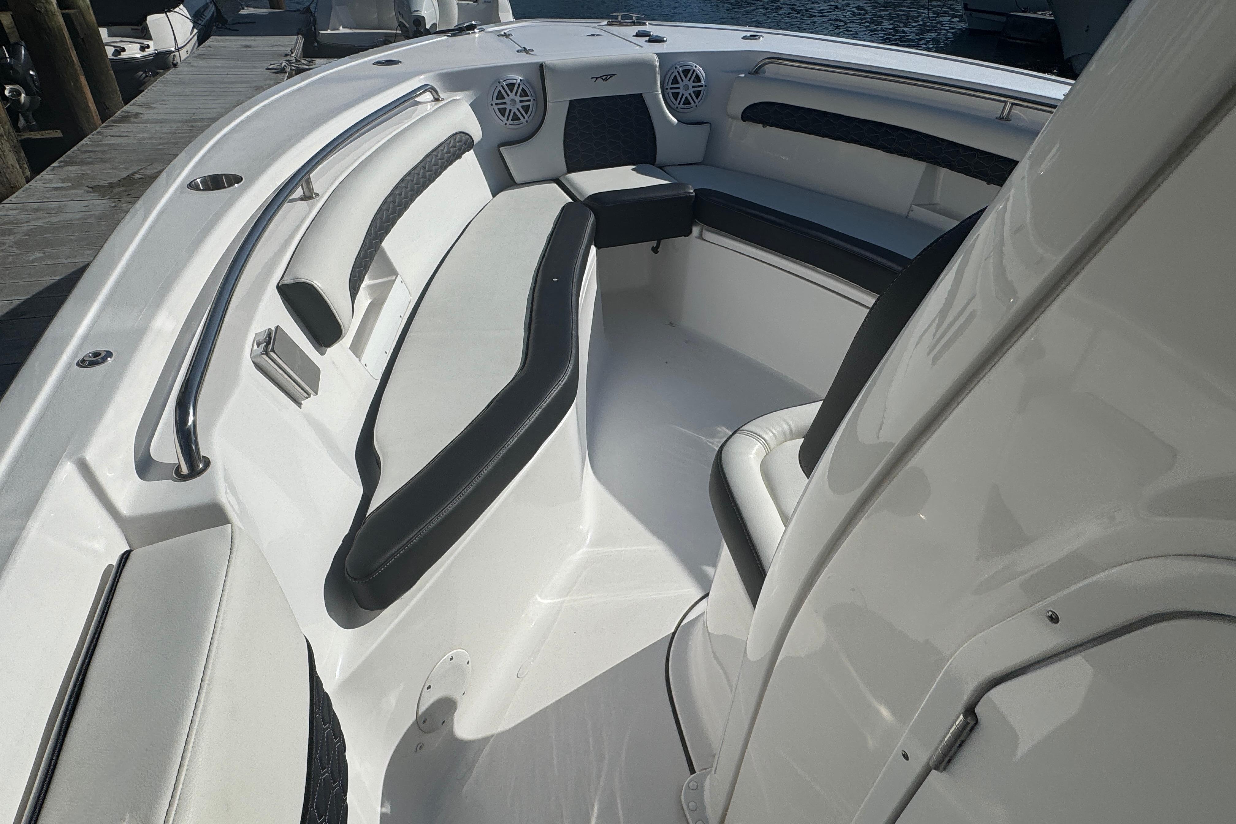 2025 Tidewater 232 LXF boat interior with cushioned seating and sleek design.